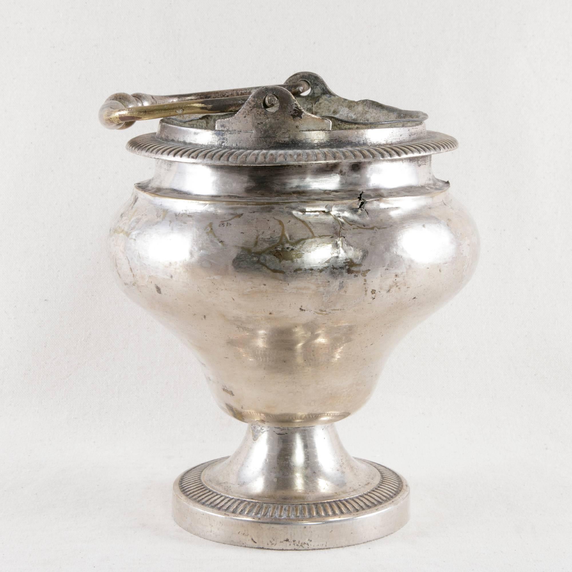 This 18th century French silver plate holy water vessel with handle has its original zinc liner. It was originally used in a church by the priest who walked down the central aisle to bless the congregation by sprinkling holy water over them, circa
