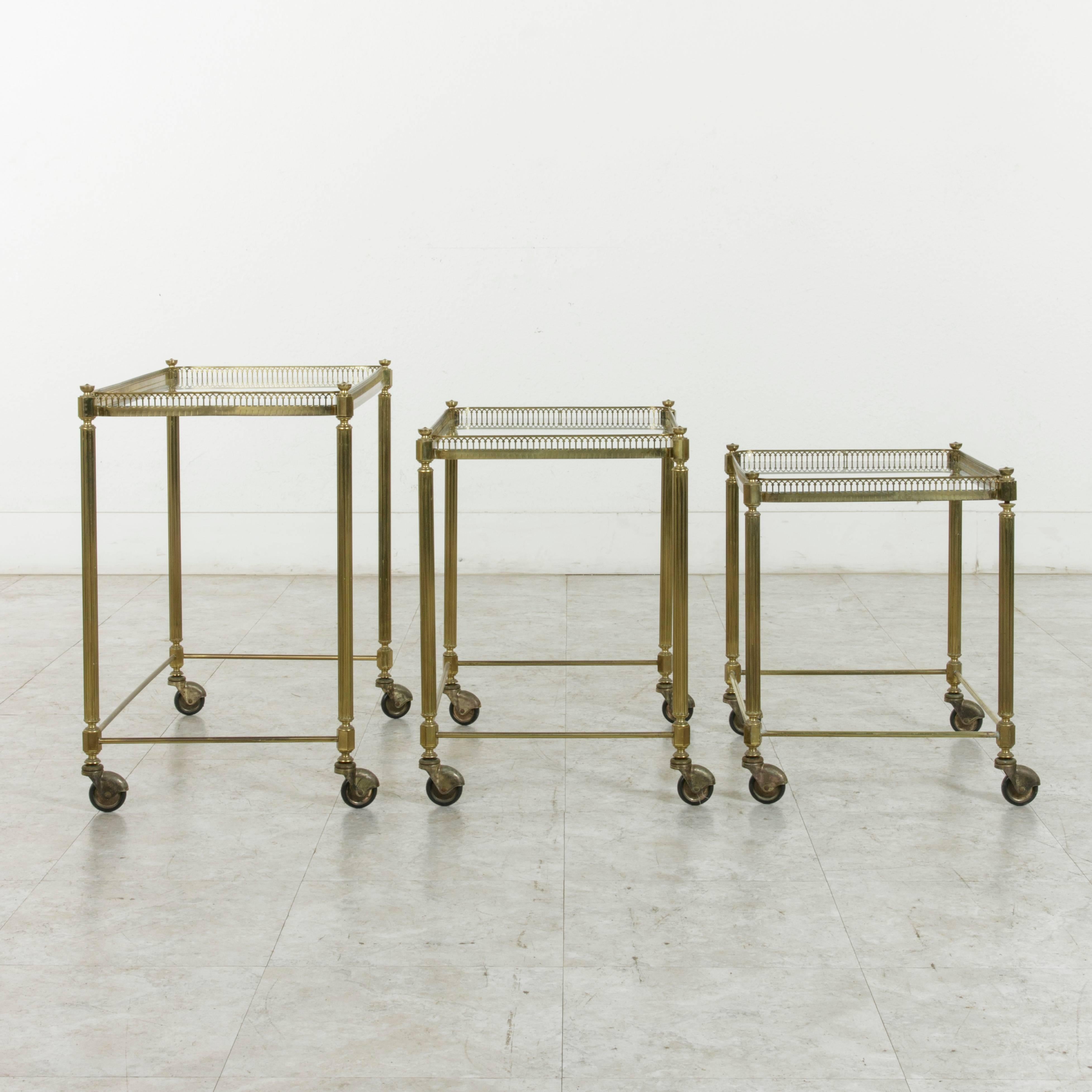 Set of Three Midcentury French Brass and Glass Nesting Tables on Casters 6