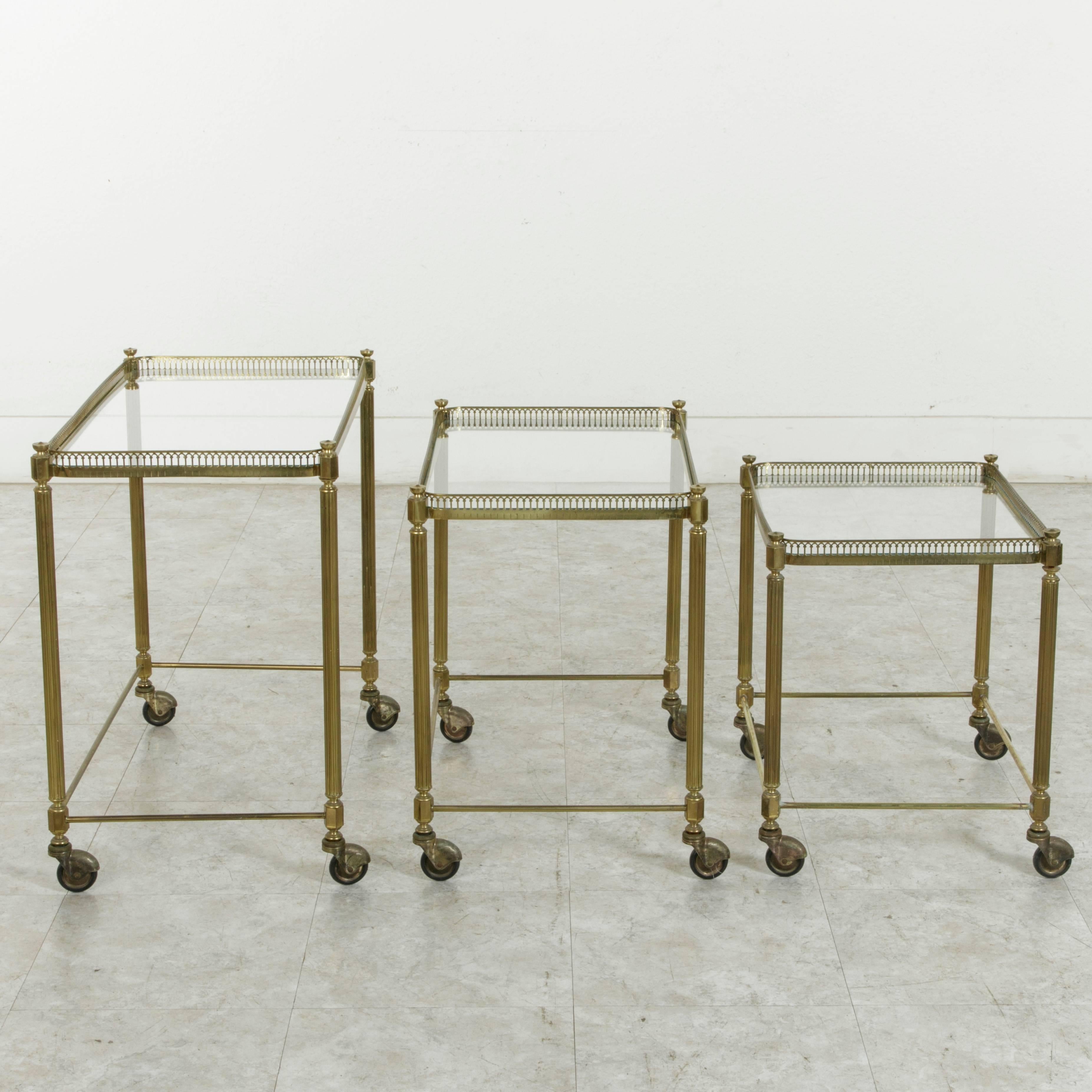 Set of Three Midcentury French Brass and Glass Nesting Tables on Casters 5