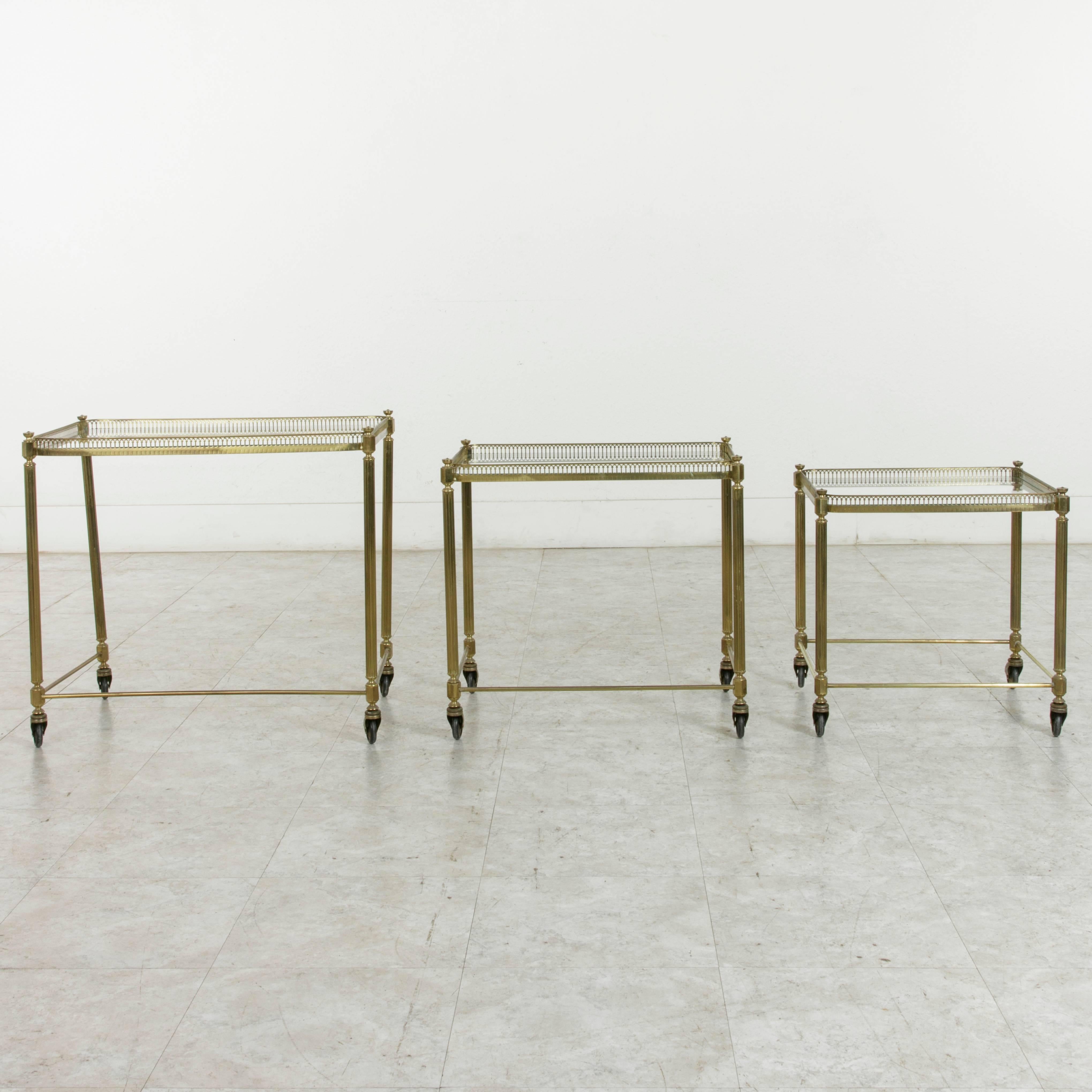 Set of Three Midcentury French Brass and Glass Nesting Tables on Casters 4