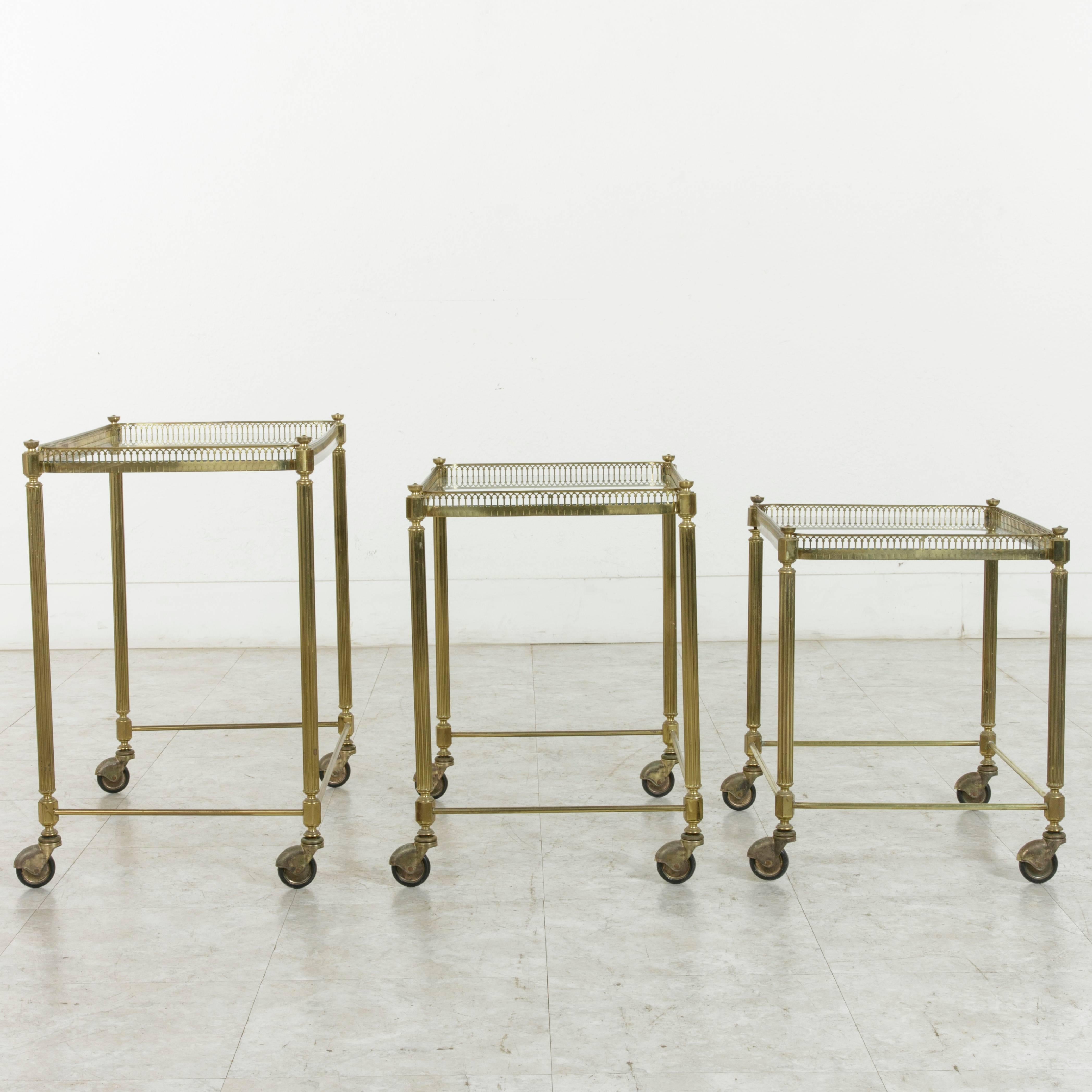 Set of Three Midcentury French Brass and Glass Nesting Tables on Casters 3