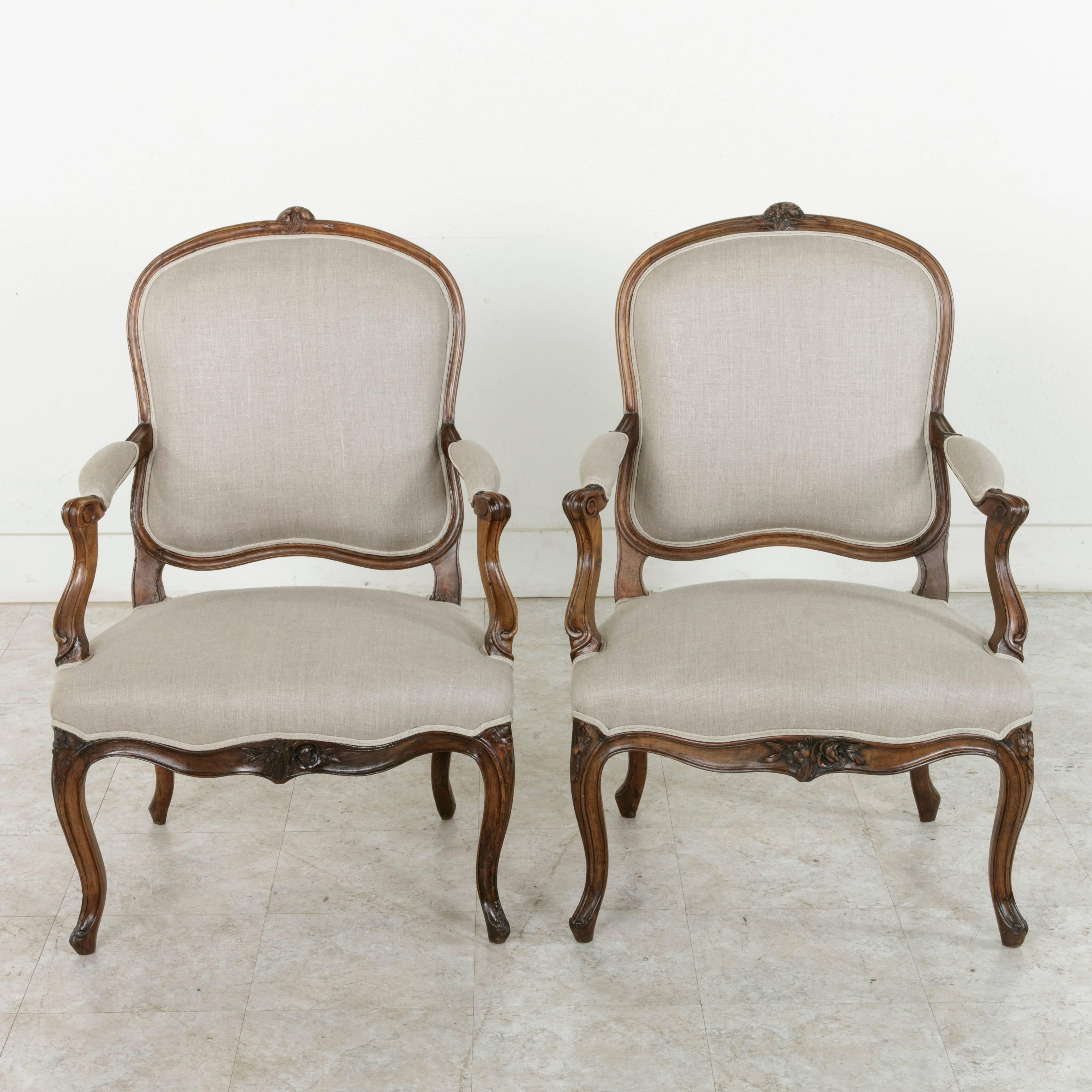 Hand-Carved Pair of 19th Century Hand Carved Walnut French Louis XV Style Armchairs in Linen