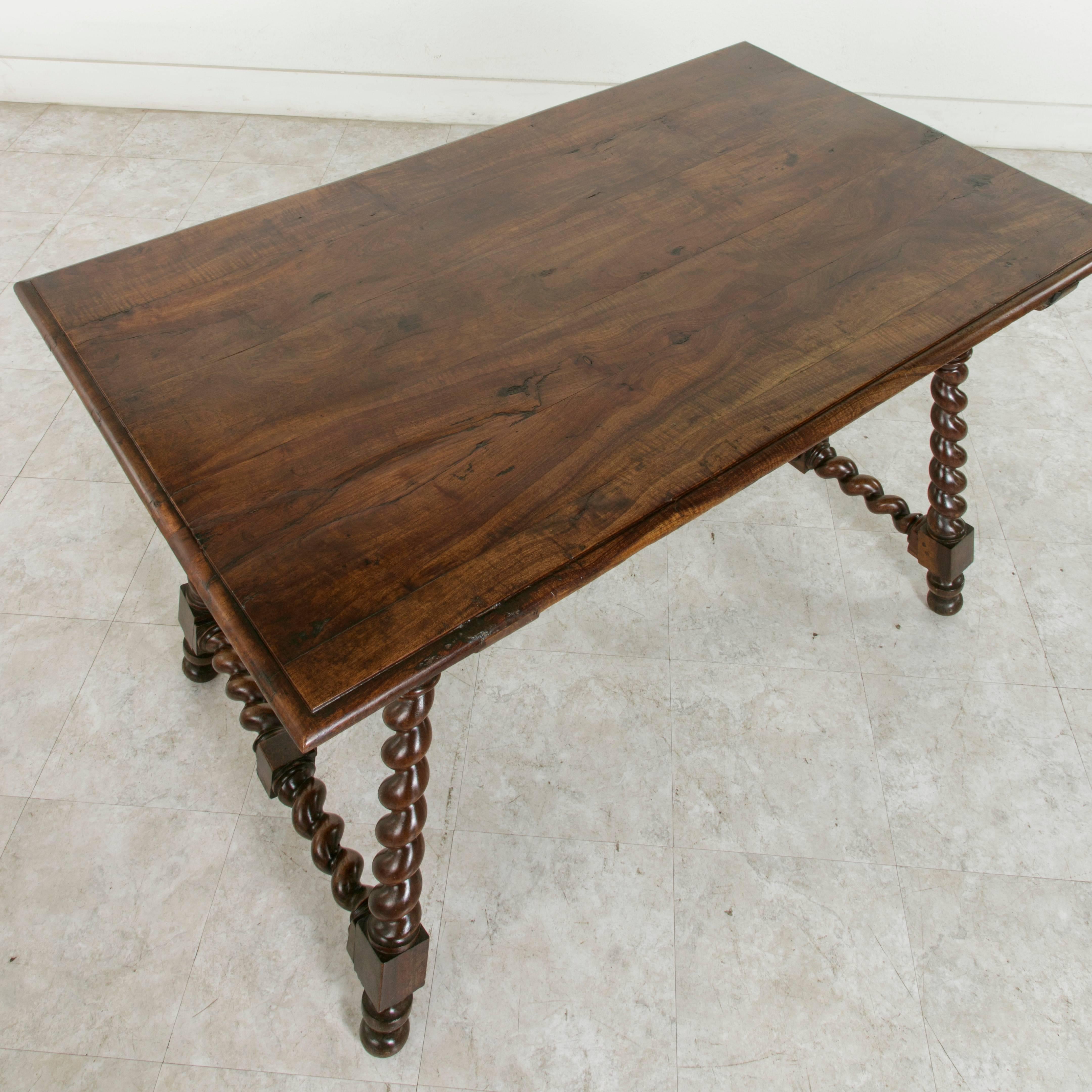 French 19th Century Spanish Renaissance Style Walnut Table with Forged Iron Stretcher