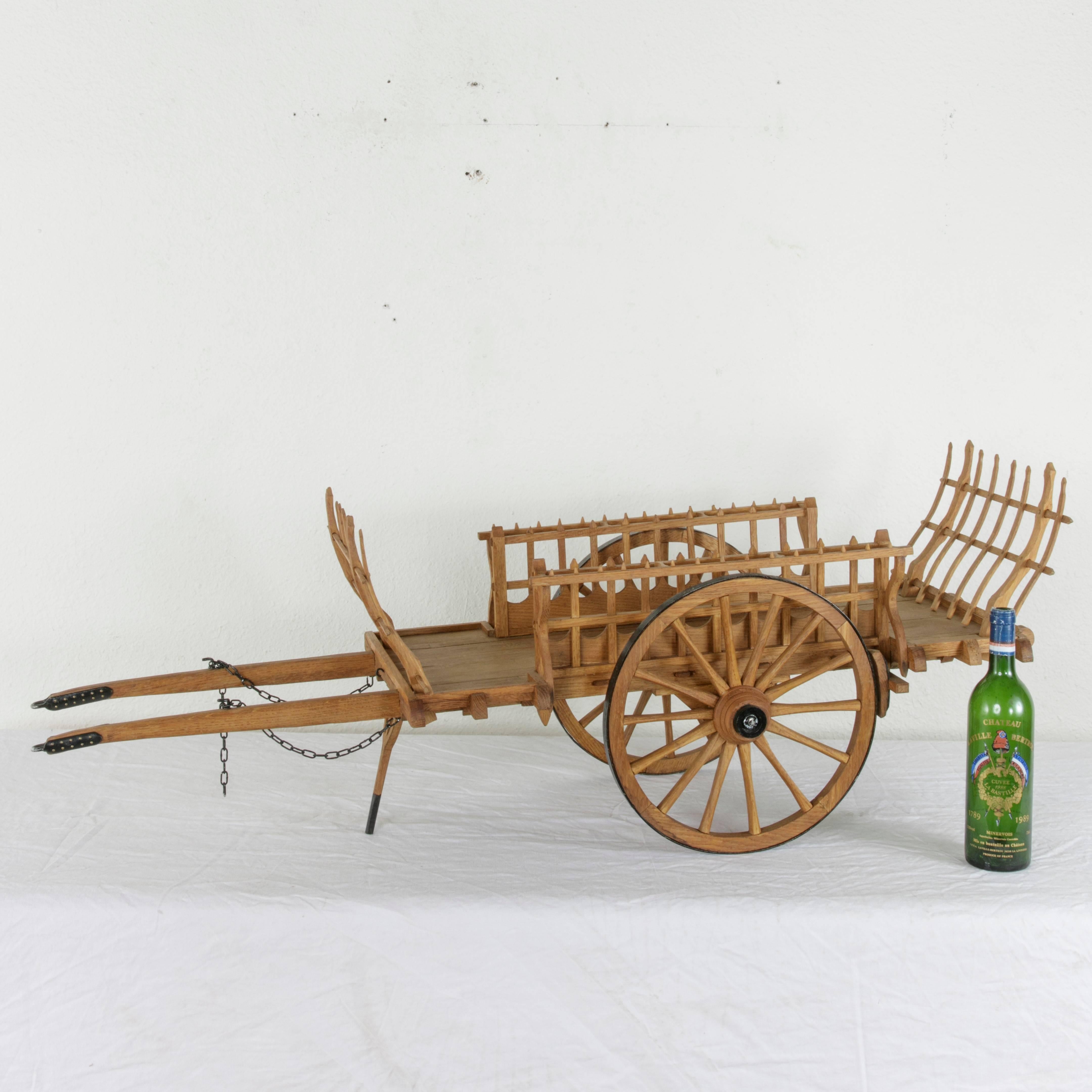 Found in the city of Sees in Normandy, France, this large-scale wooden model hay wagon was entirely hand carved and hand pegged by a Compagnon de France. The institution of the Compagnons or journeymen is an apprenticeship organization in which