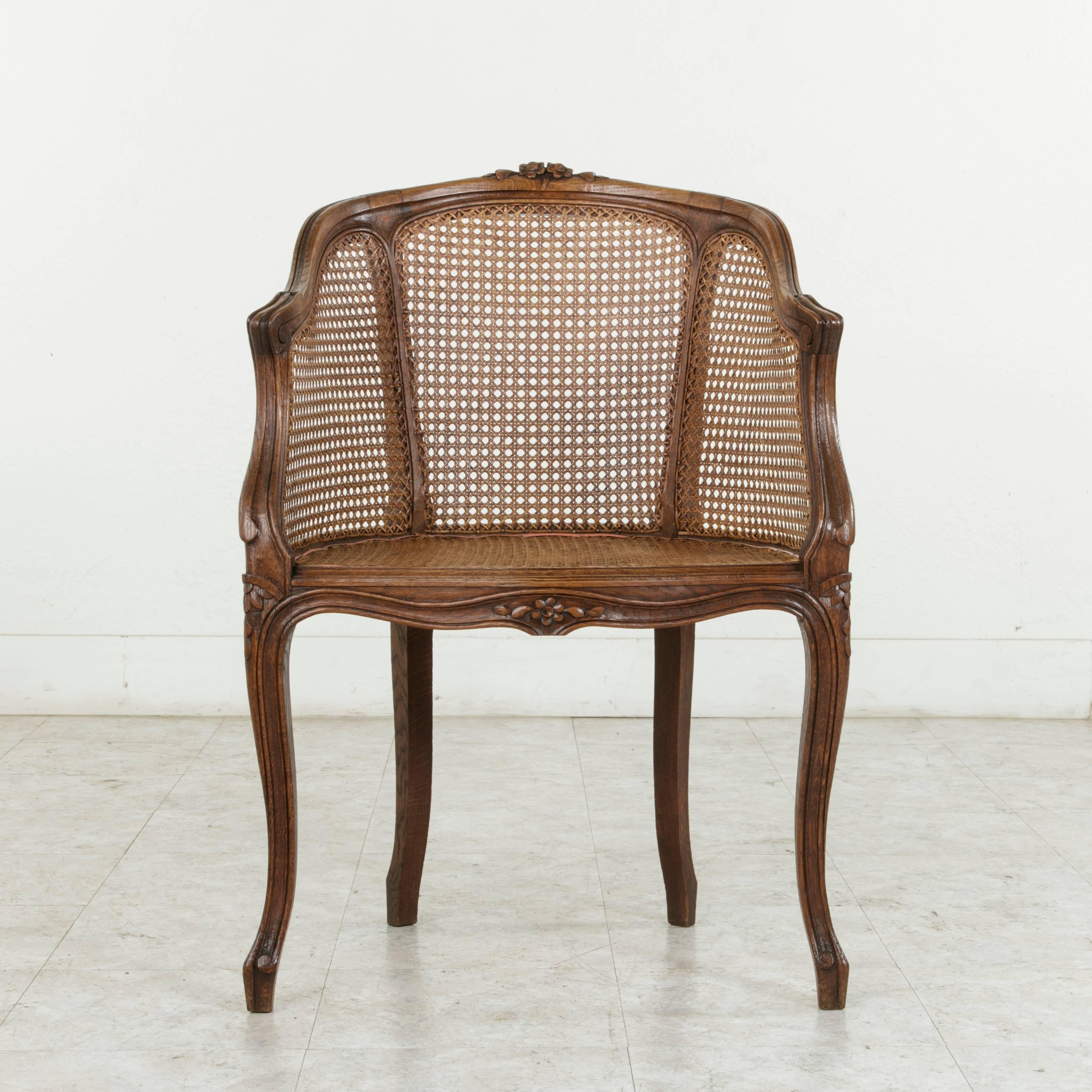 Early 20th Century French Louis XV Style Hand-Carved Oak and Caned Bergere In Excellent Condition In Fayetteville, AR