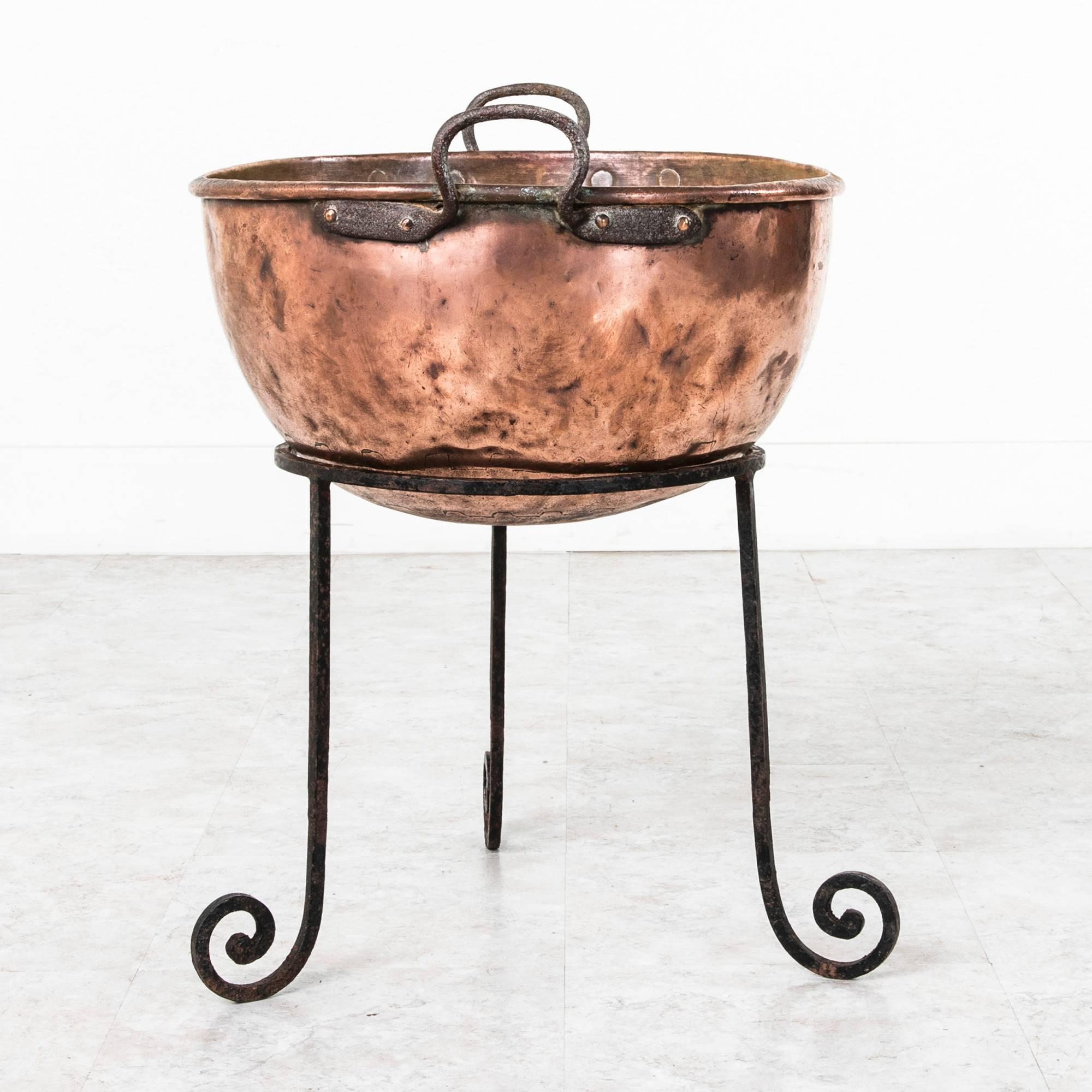 This nineteenth century copper brazier is of an ideal scale for chilling drinks or to serve as a dramatic planter for indoor or outdoor use.  This piece would also display wood beautifully by a hearth.  The large copper bowl is hand hammered with