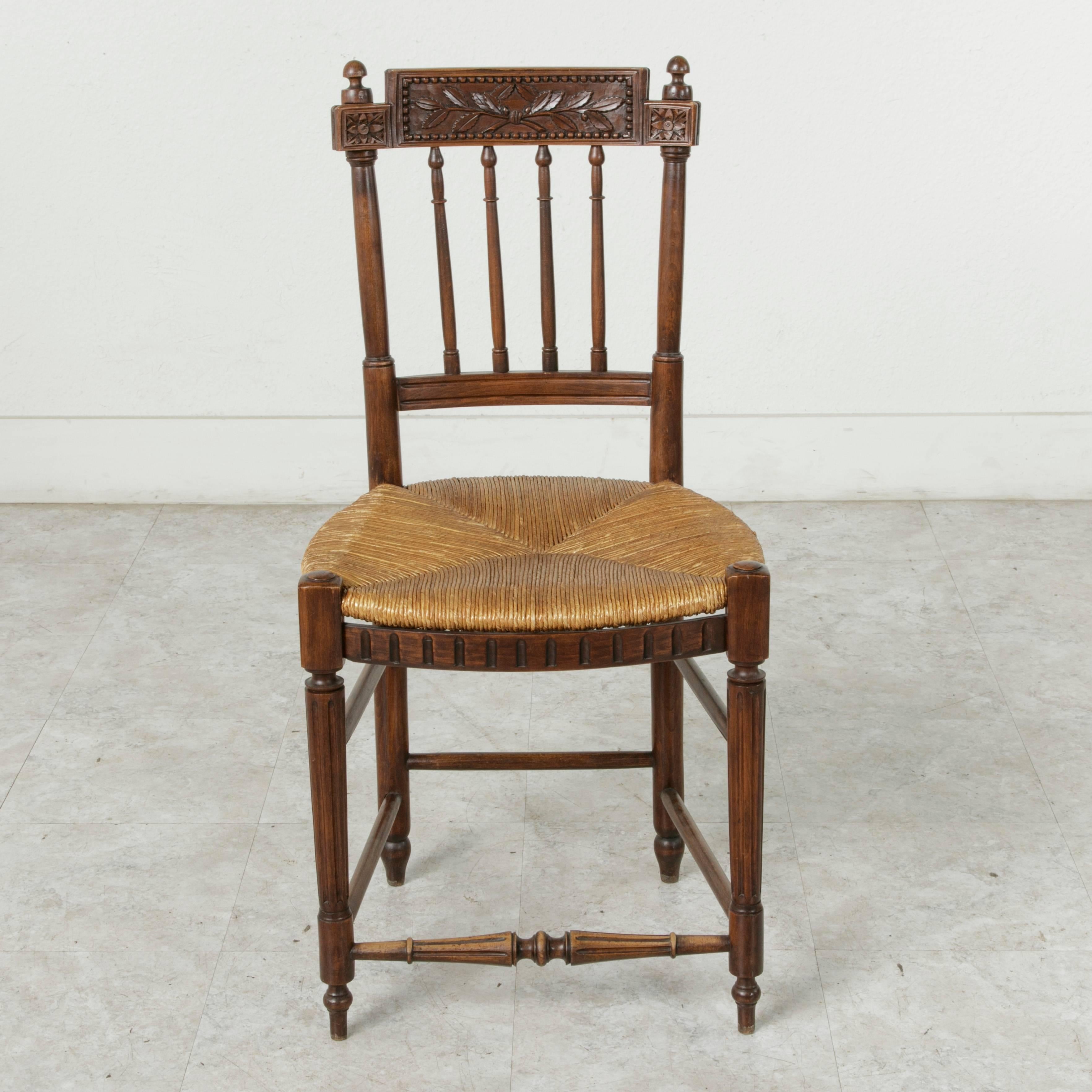 Set of Four 19th Century French Directoire Style Carved Walnut Rush Seat Chairs In Excellent Condition In Fayetteville, AR