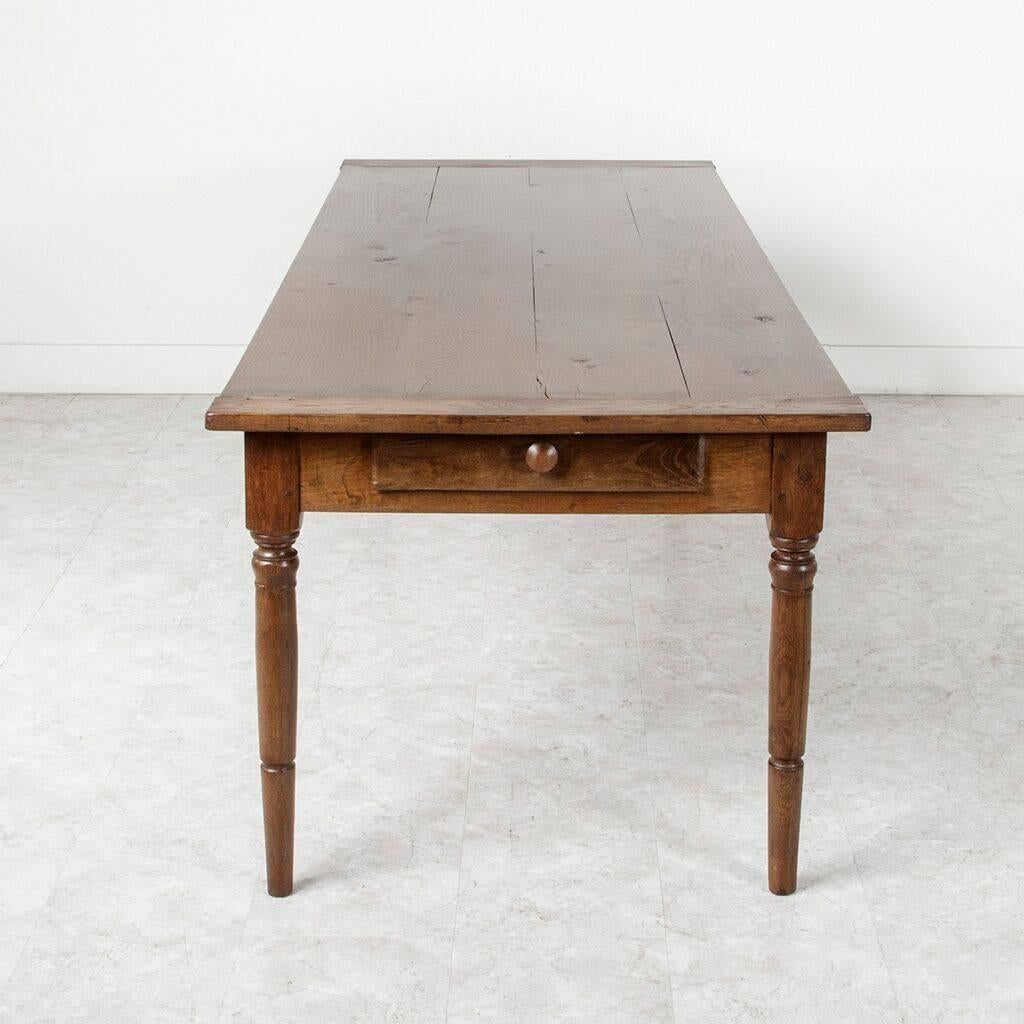Early 20th Century Long Ten-Seat Antique French Farm Table of Solid Hand Pegged Oak from Normandy