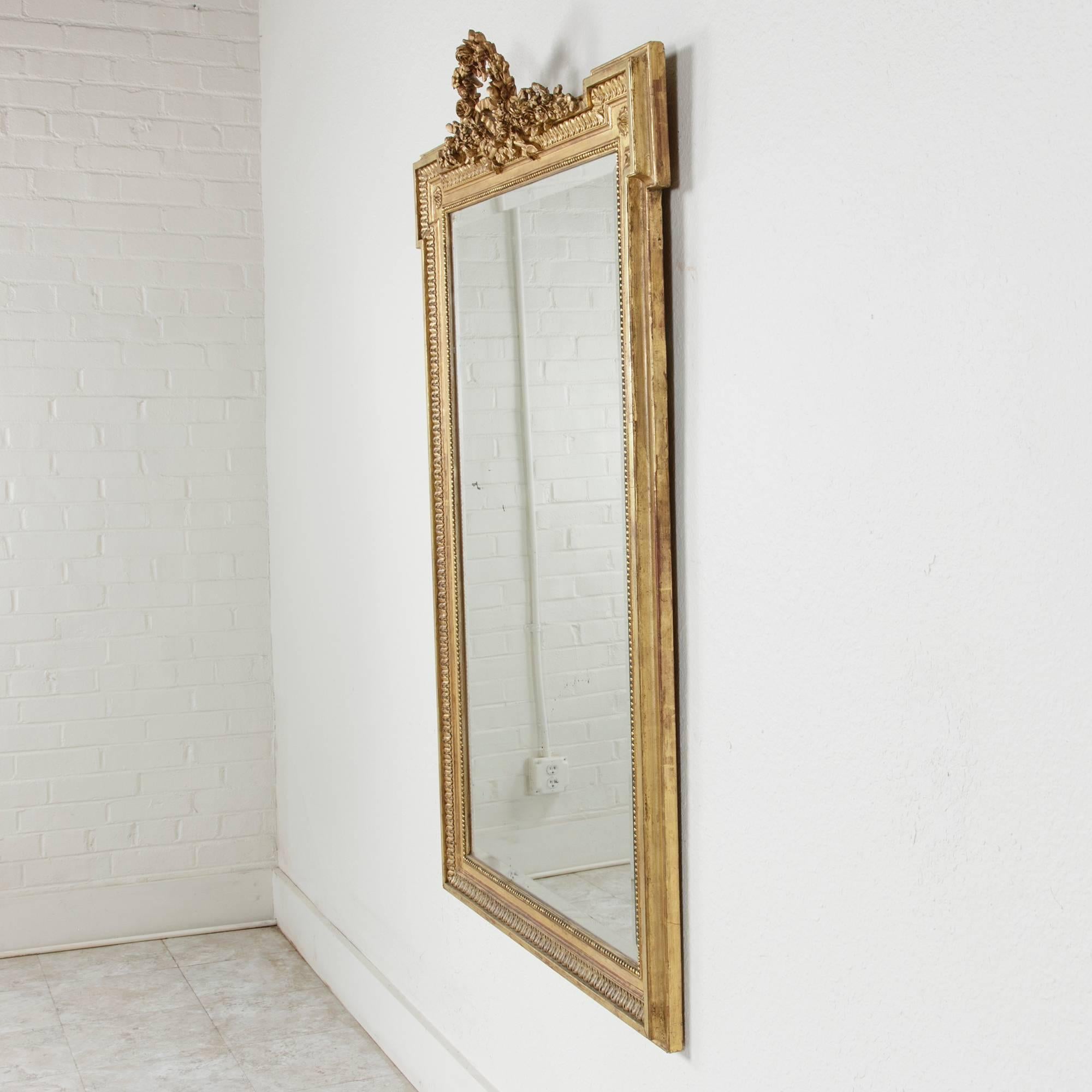 Late 19th Century Large 19th Century Louis XVI Style Giltwood Mirror with Original Beveled Glass