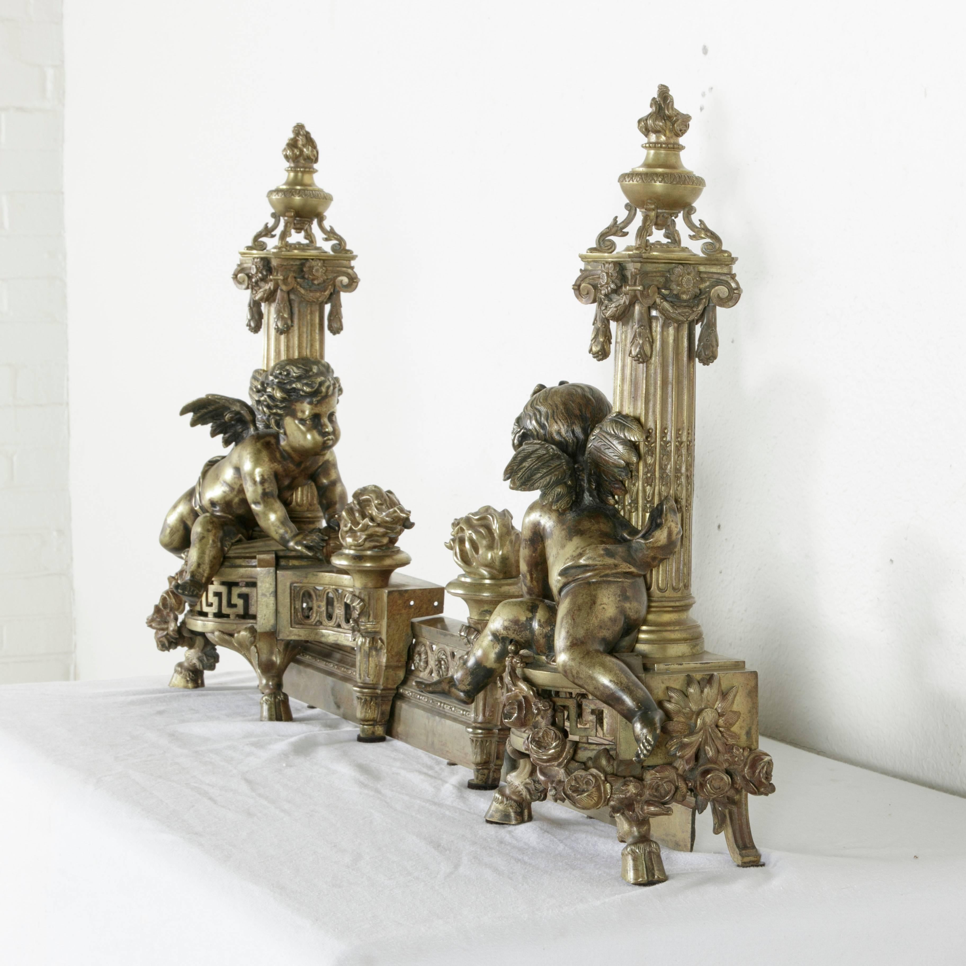 This grand early 19th century fireplace fender in solid bronze was recently discovered in a Paris hotel particulier or private mansion that had been closed up for over fifty years. Two cherubs, one boy and one girl, with their quivers of arrows, are