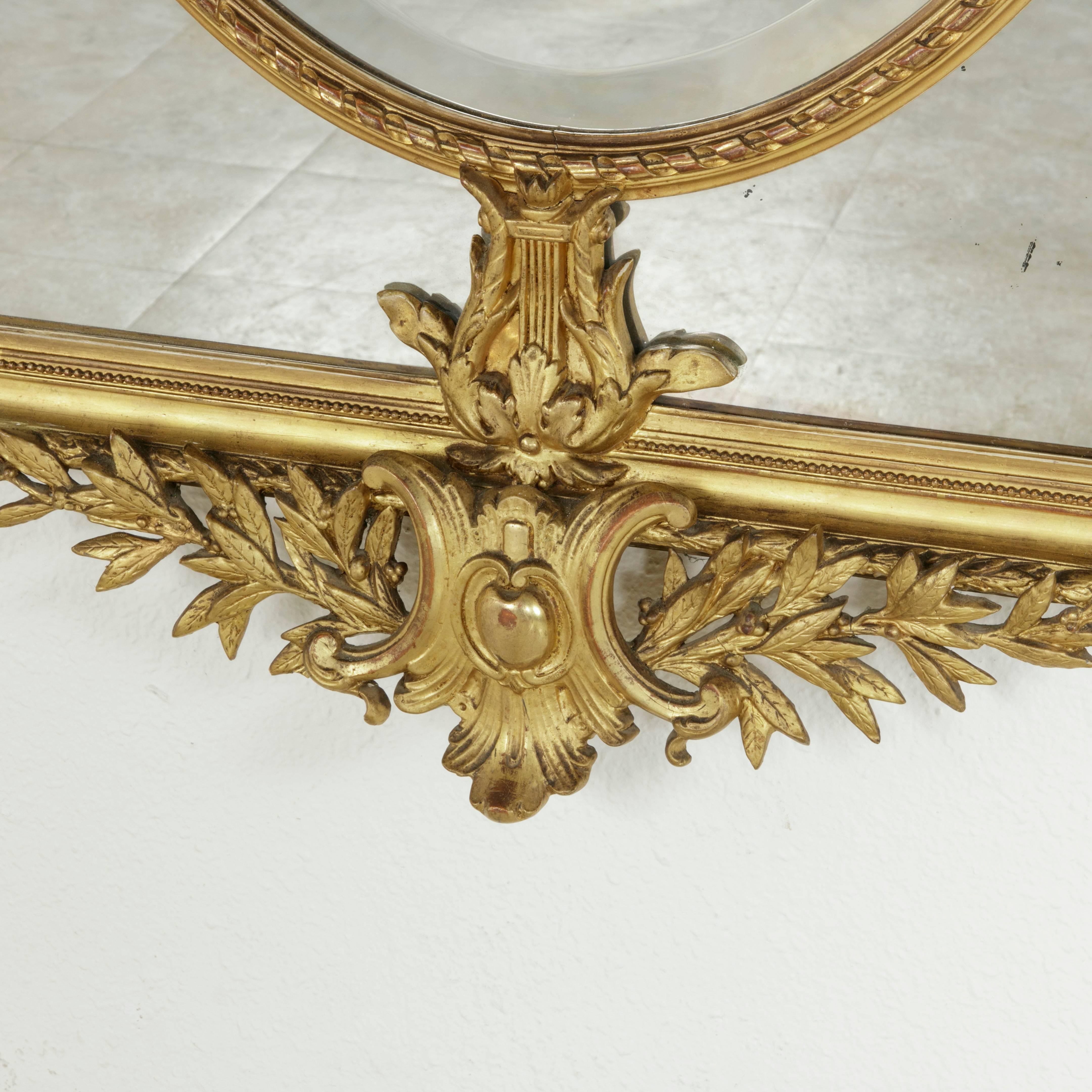 Late 19th Century Large 19th Century Louis XVI Style Giltwood and Beveled Mirror with Inset Oval