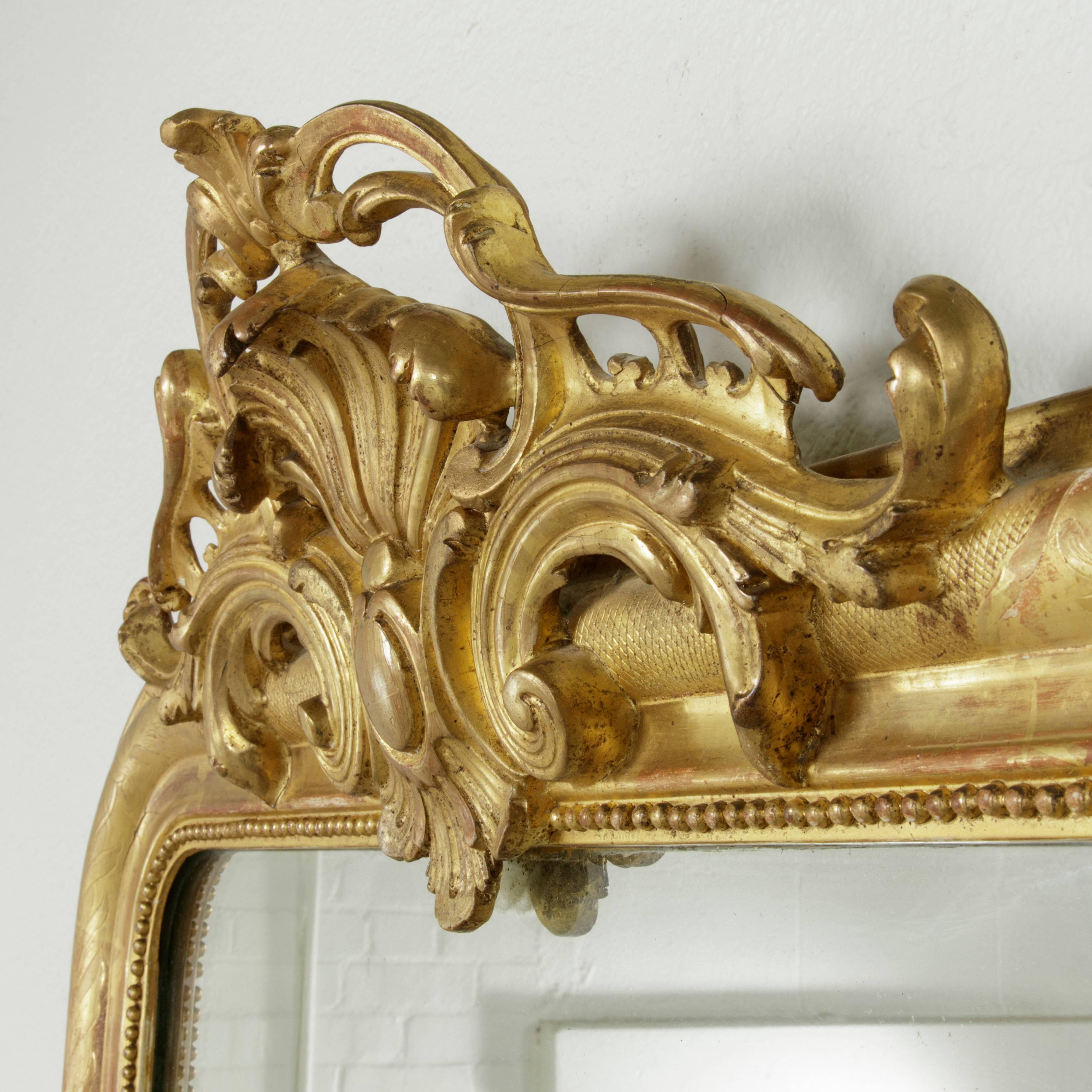 19th Century French Incised Gilt Wood Louis Philippe Mirror With Regency Flourish 