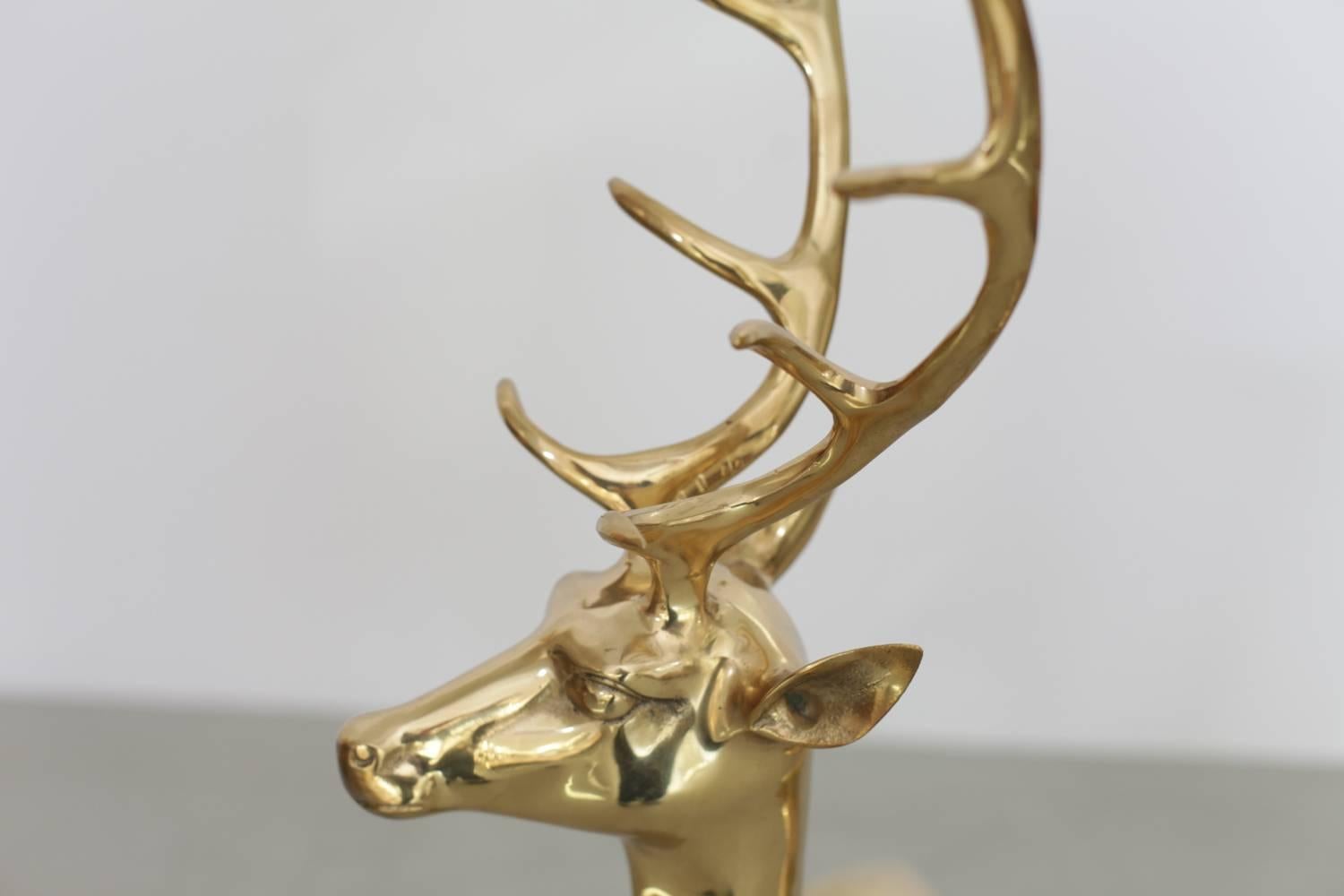 Extraordinary huge set of two deer made of brass. They are in excellent condition and they bring the Hollywood Regency glamour in every room.