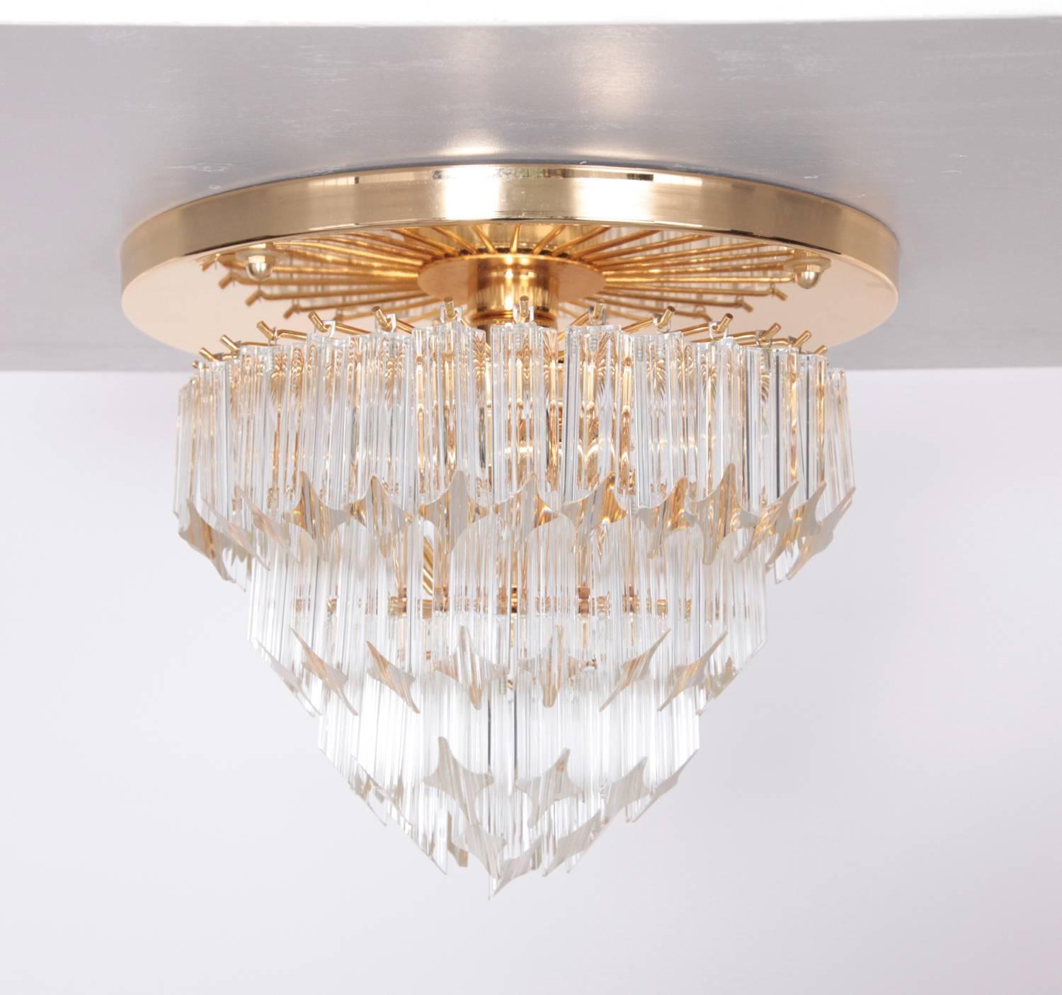 Beautiful ceiling lamp Astra Quadrilobo by Venini, Italy from the 1970s. 
The wall plate is made of brass and the shade contains 77 solid glasses.
Some of the glass parts have small chips but they are hardly visible as you can see on the