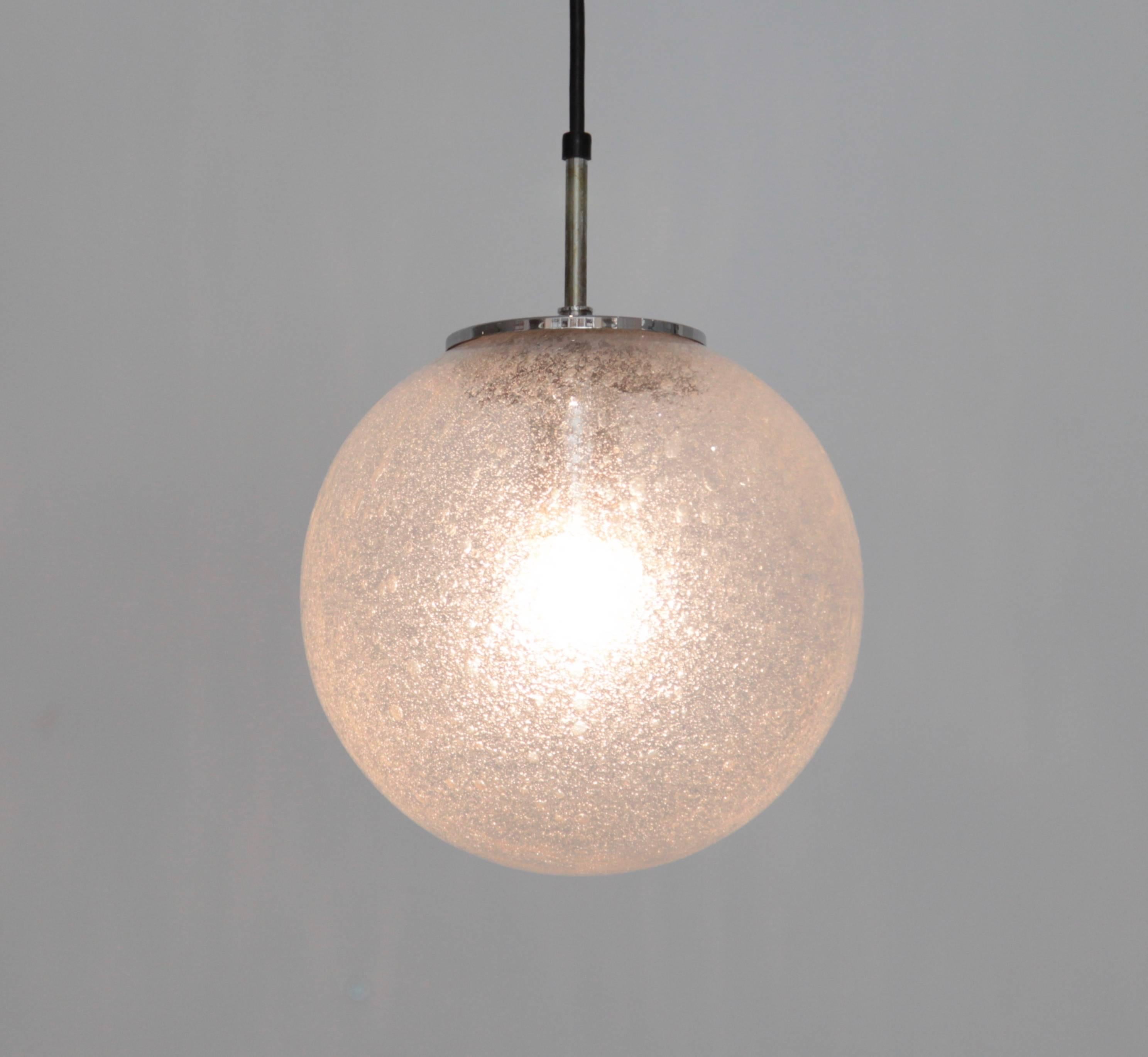 Globe pendant lamps made of handblown glass and chrome hardware. They were produced in the 1970s by the German high end glass manufacturer Glashütte Limburg. 20 pieces available.
To be on the the safe side, the lamp should be checked locally by a