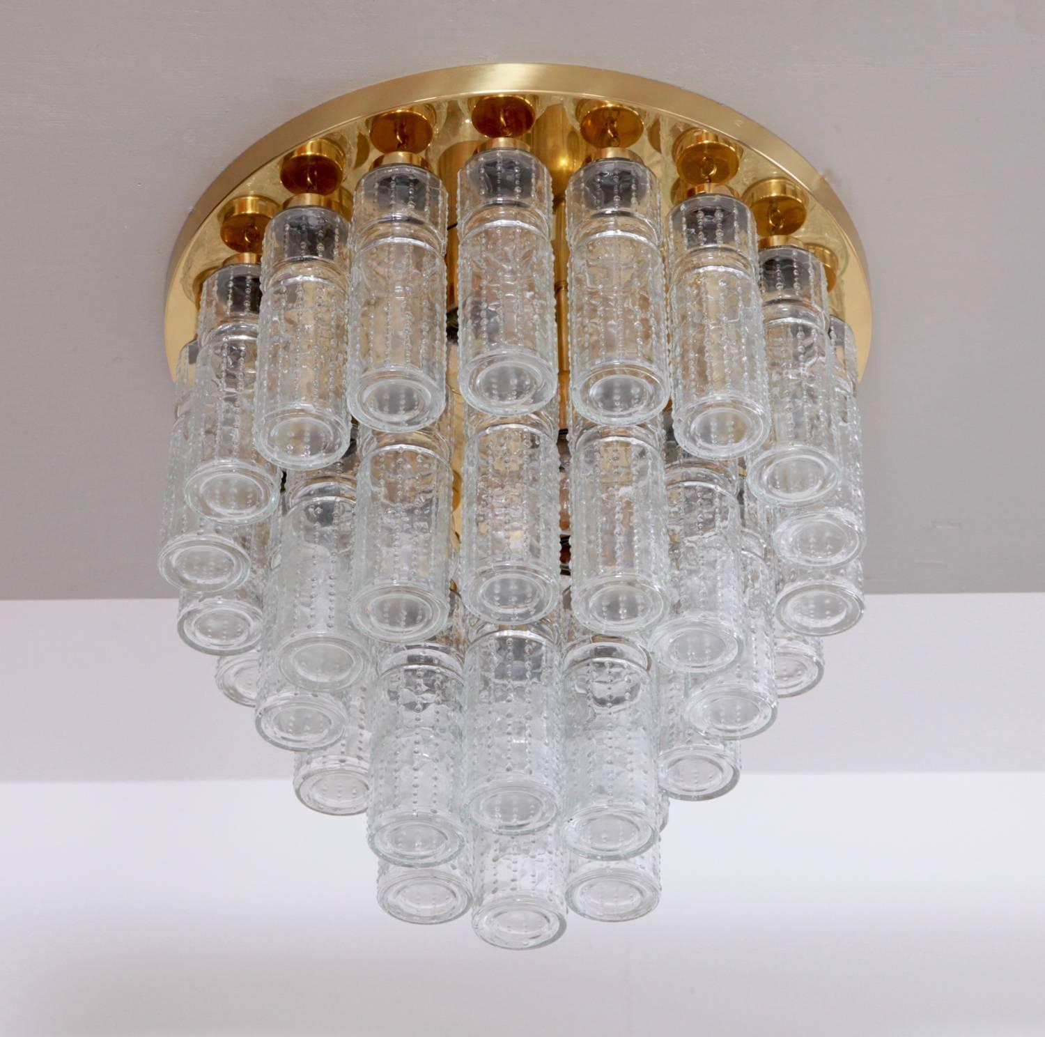 Rare multi-tier flush mounts or chandeliers with handblown glass pieces on a brass base. The lamps are high quality production of the 1960s from Glashütte Limburg. They are from a German casino and in very good condition. Almost impossible to find