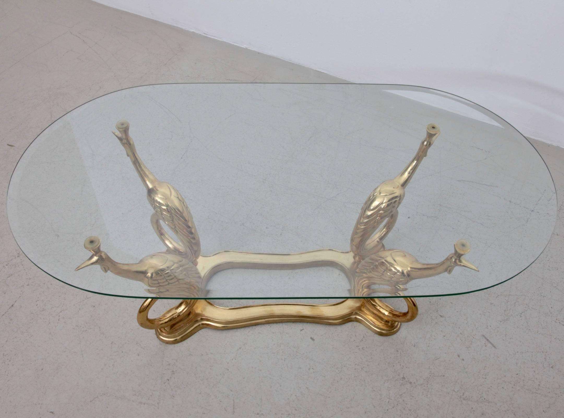Very elegant coffee or side table in brass and glass. The mint glass tabletop is holded by four peacocks. The table is a real eyecatcher. The same table in another form is also listed.

