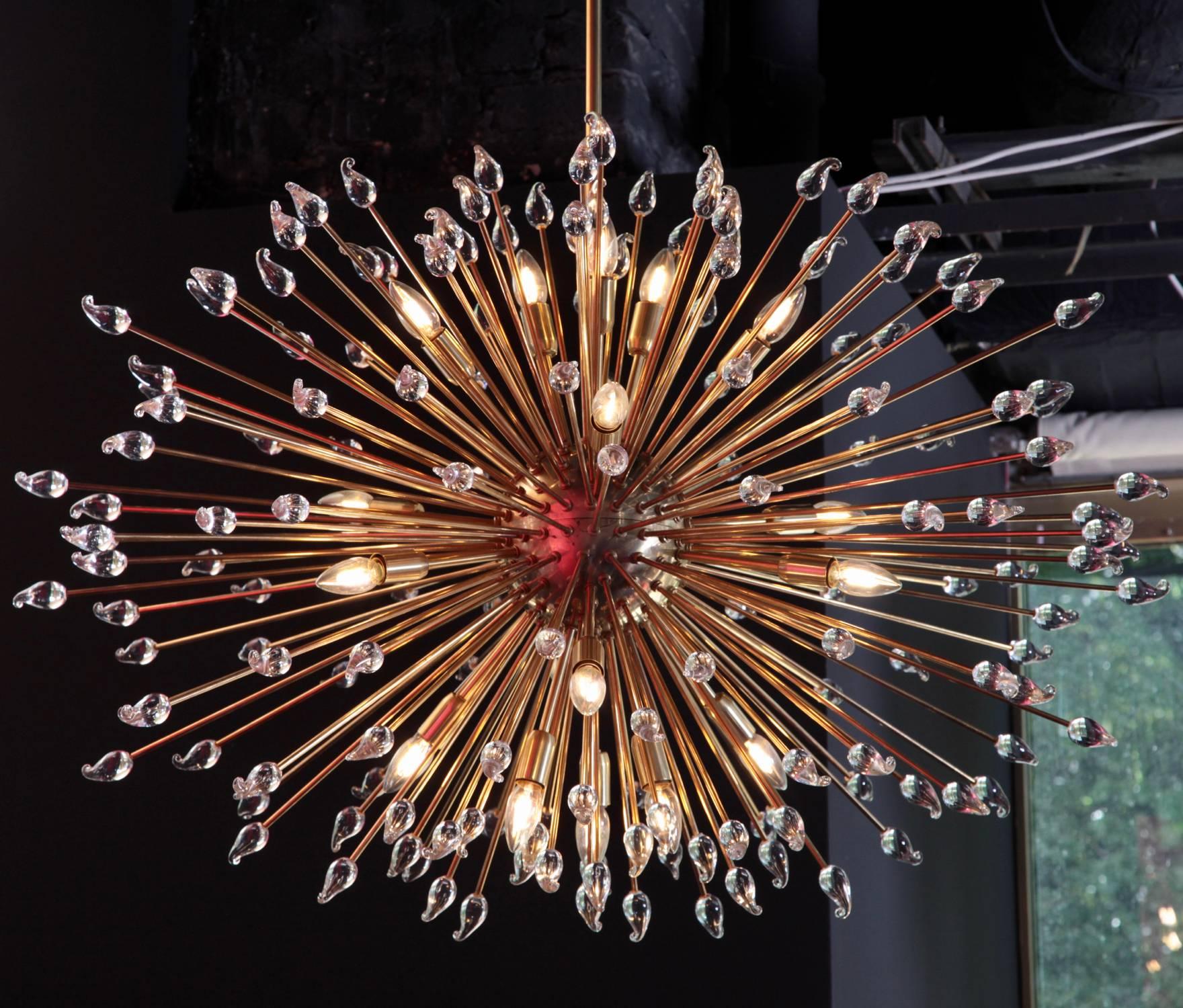 Very large and impressive brass Sputnik or urchin chandelier with Murano glass teardrop ends. The chandelier will be a real highlight in every room and is in very good condition. 18 x E14 bulbs.

To be on the the safe side, the lamp should be