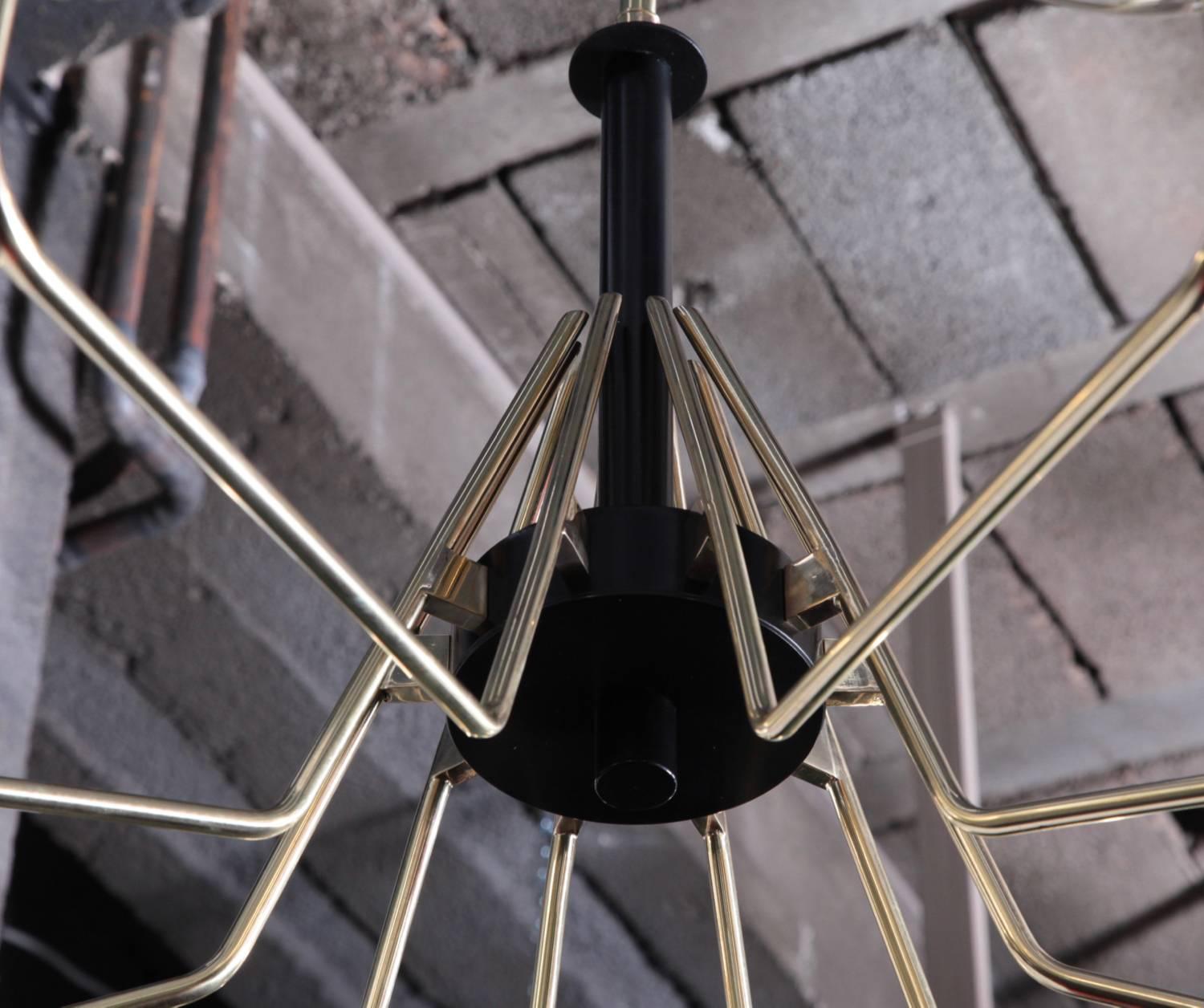 Monumental brass and black metal Sputnik chandelier with stained glass globes. The chandelier has a very impressing size and is a real eye-catcher in every room. The chandelier is in excellent condition. Measures: 10 x E27 model a bulb.
To be on the