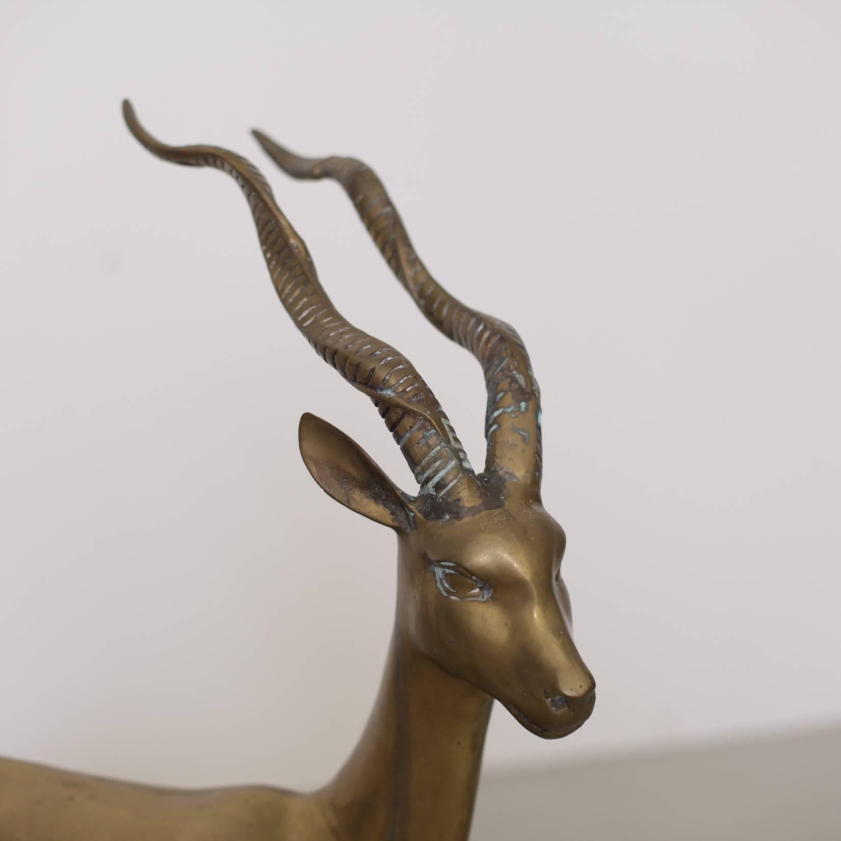 Extraordinary huge ibex or deer made of brass. It´s in very good condition and it brings the Hollywood regency glamour in every room. Perfect christmas decoration.


