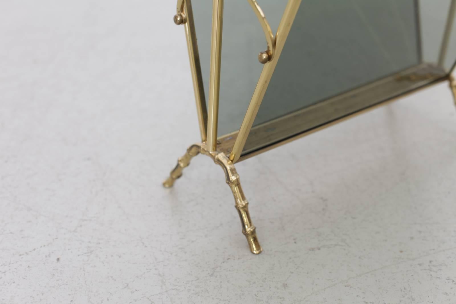 Very elegant faux bamboo magazine rack by Maison Bagues. The rack is made of brass and with smoked glass in an excellent quality. Very condition.

