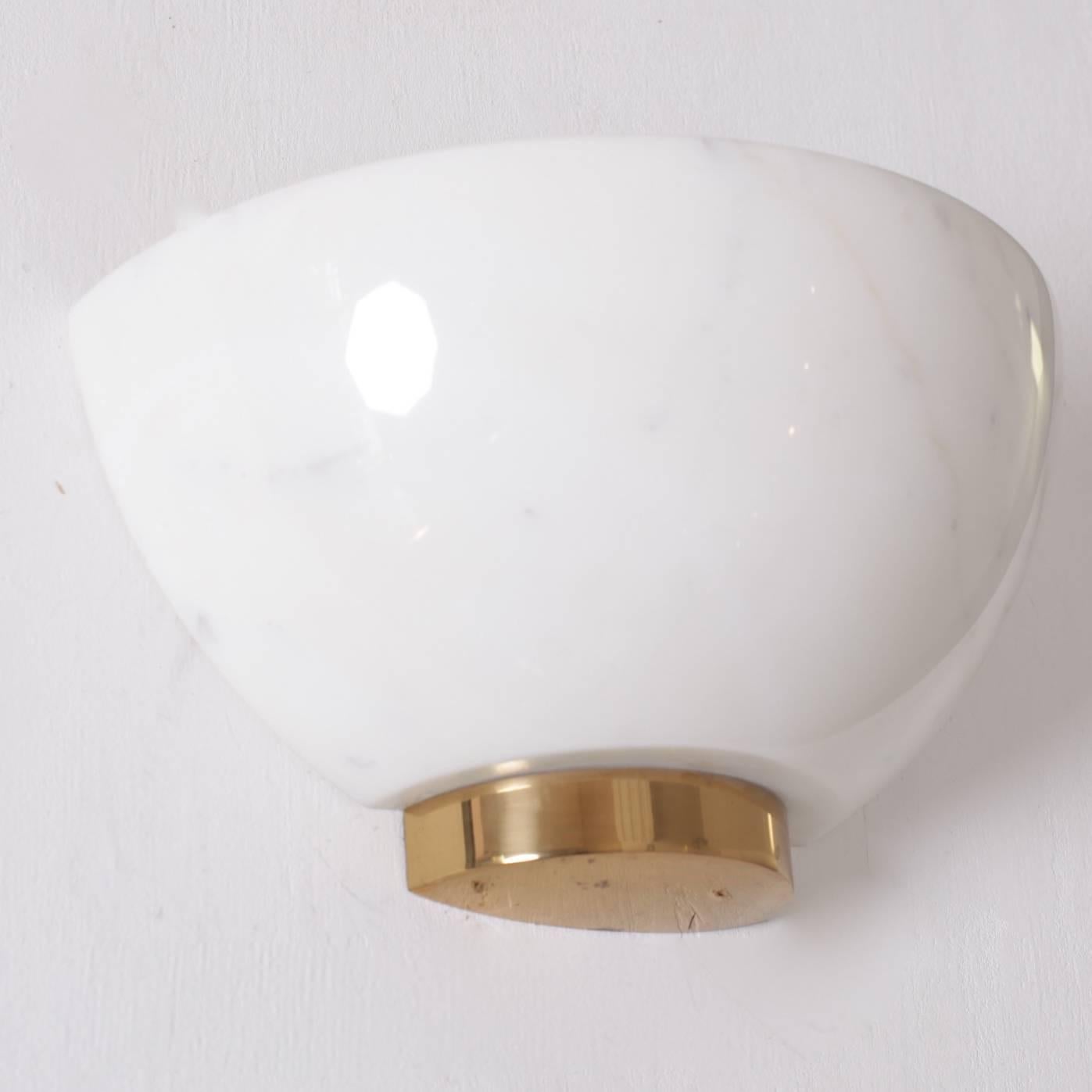 Very nice pair of white Carrara  marble and brass wall lamps in form of a shell. The lamps are in a very good condition. 1x E27 / each