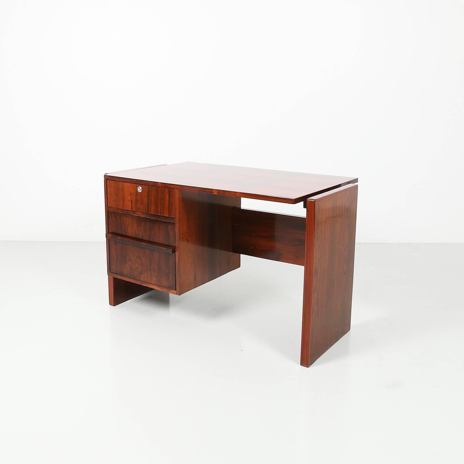 A rare example of a secretary desk designed by Joaquim Tenreiro for the offices of Bloch Editores in Rio de Janeiro, c. 1965.

Bloch Editores was the most important media group in 1960's Brazil. Tenreiro was commissioned to design many pieces for