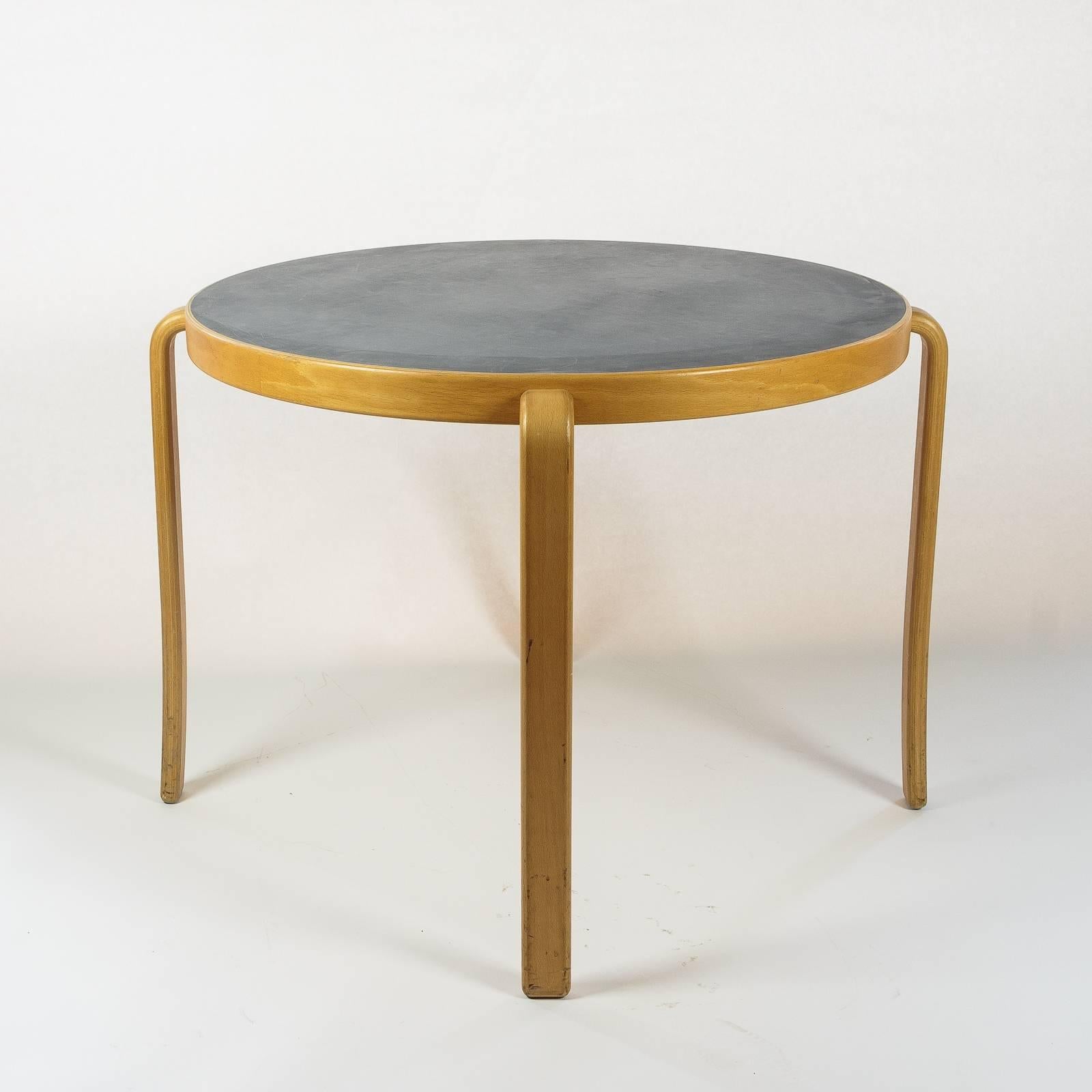 A contemporary Danish table on beech frame with faded grey laminate top.