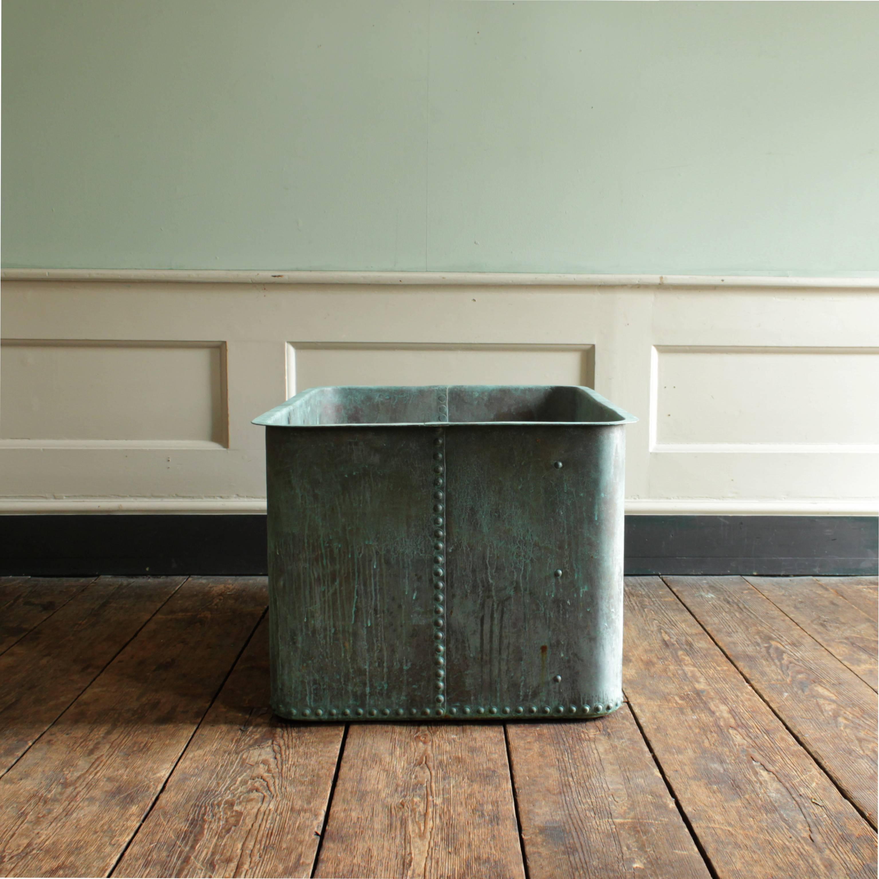 A large French copper cistern, riveted, with well patinated verdigris exterior.

Available to view at Brunswick House, London.

Dimensions: 51cm (20
