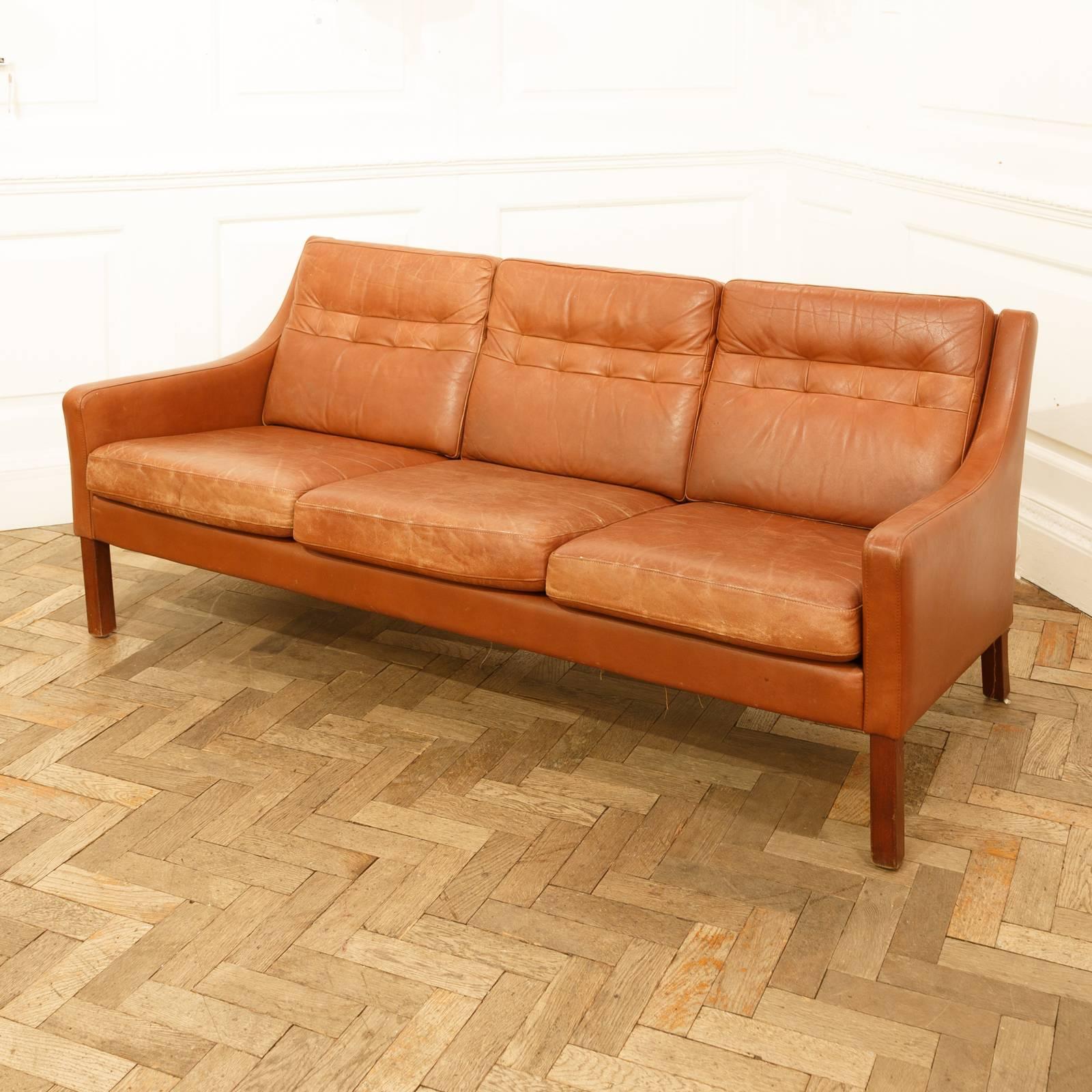 A large three-seat sofa in the style of Børge Mogensen.