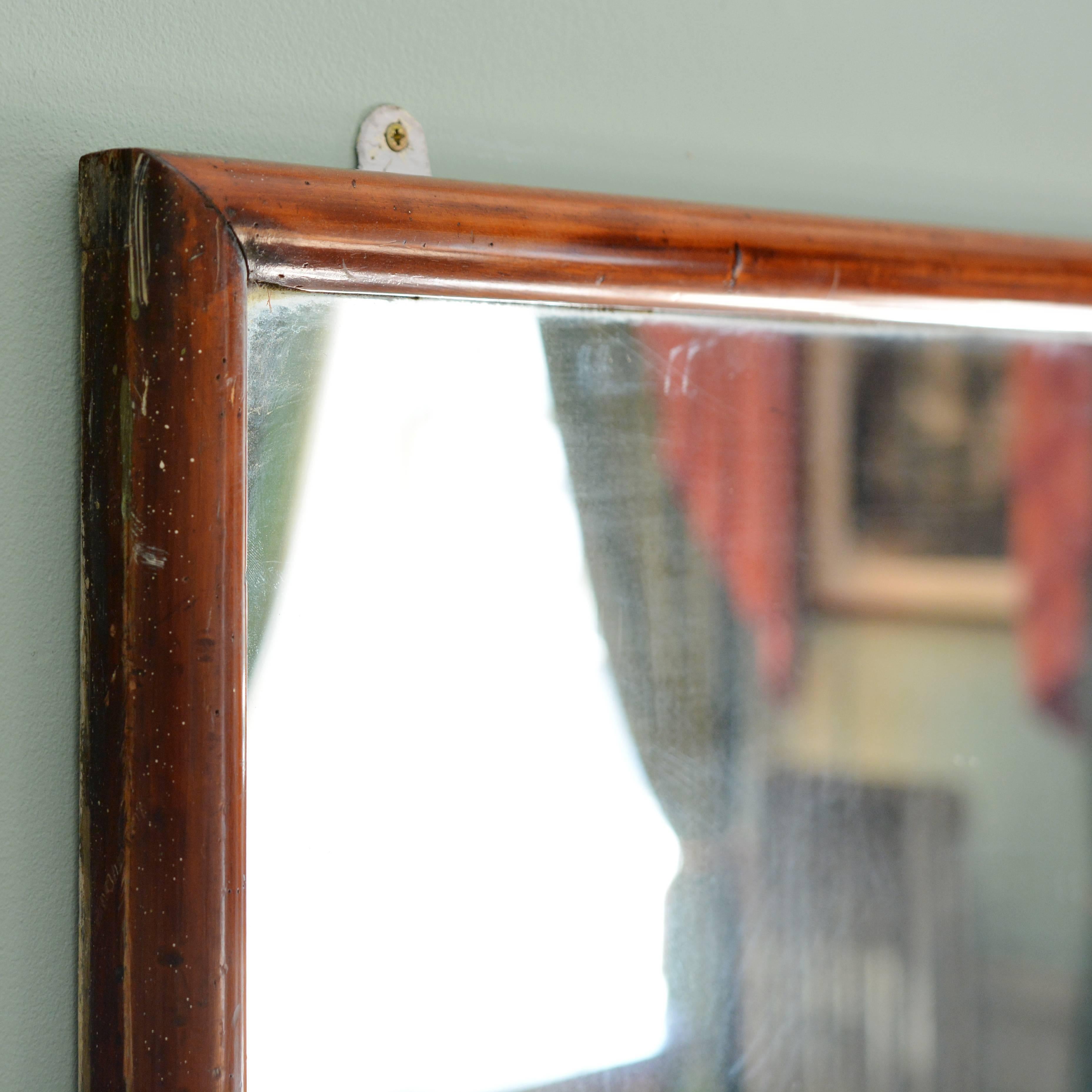 An early 20th century mahogany framed shop mirror. Can be hung portrait or landscape.

Available to view at Brunswick House, London.

Dimensions: 101cm (39¾