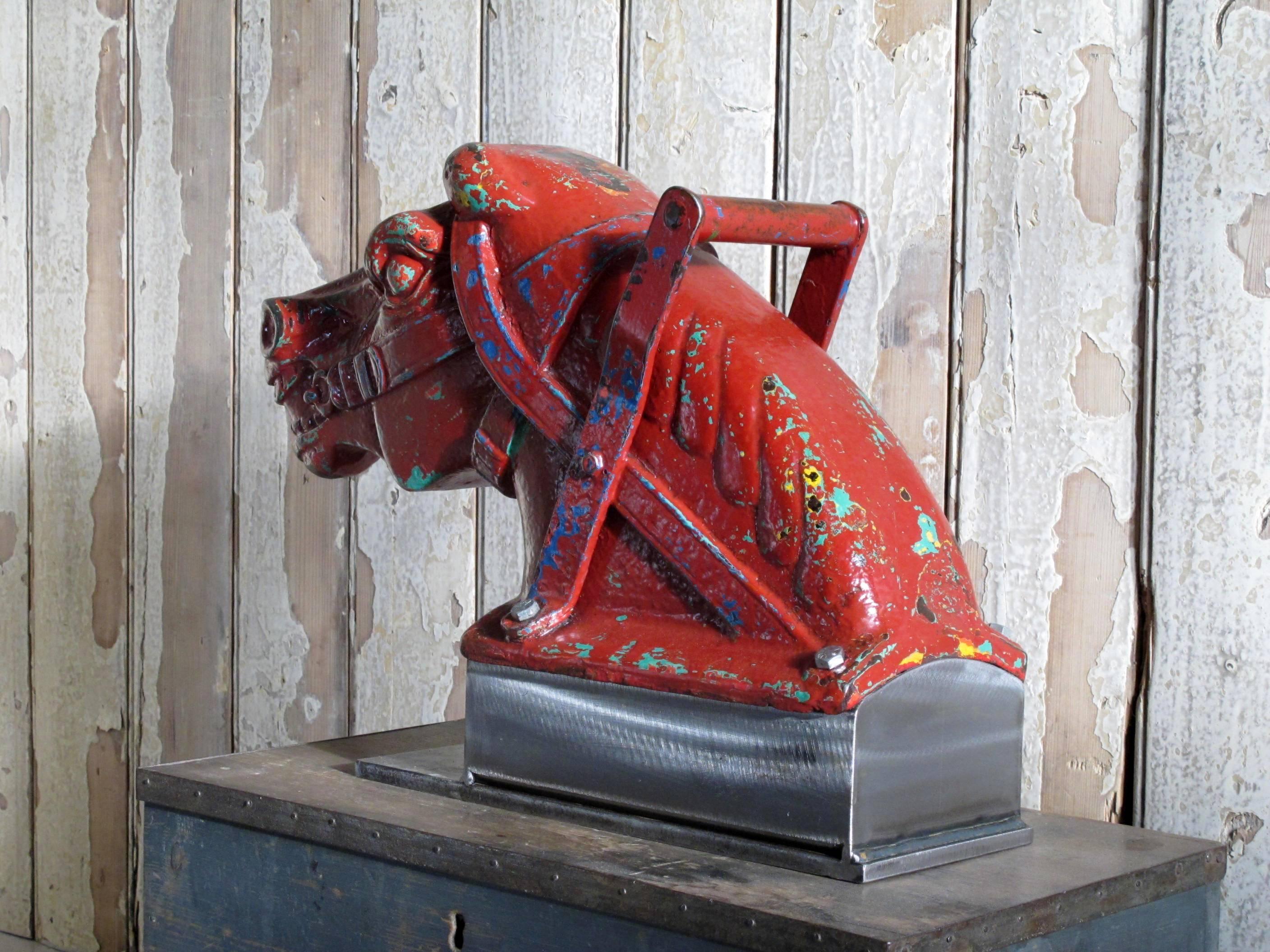 Cast-iron horse head from a playground ride. With original paint layers. Mounted onto a custom-made burnished steel base.
