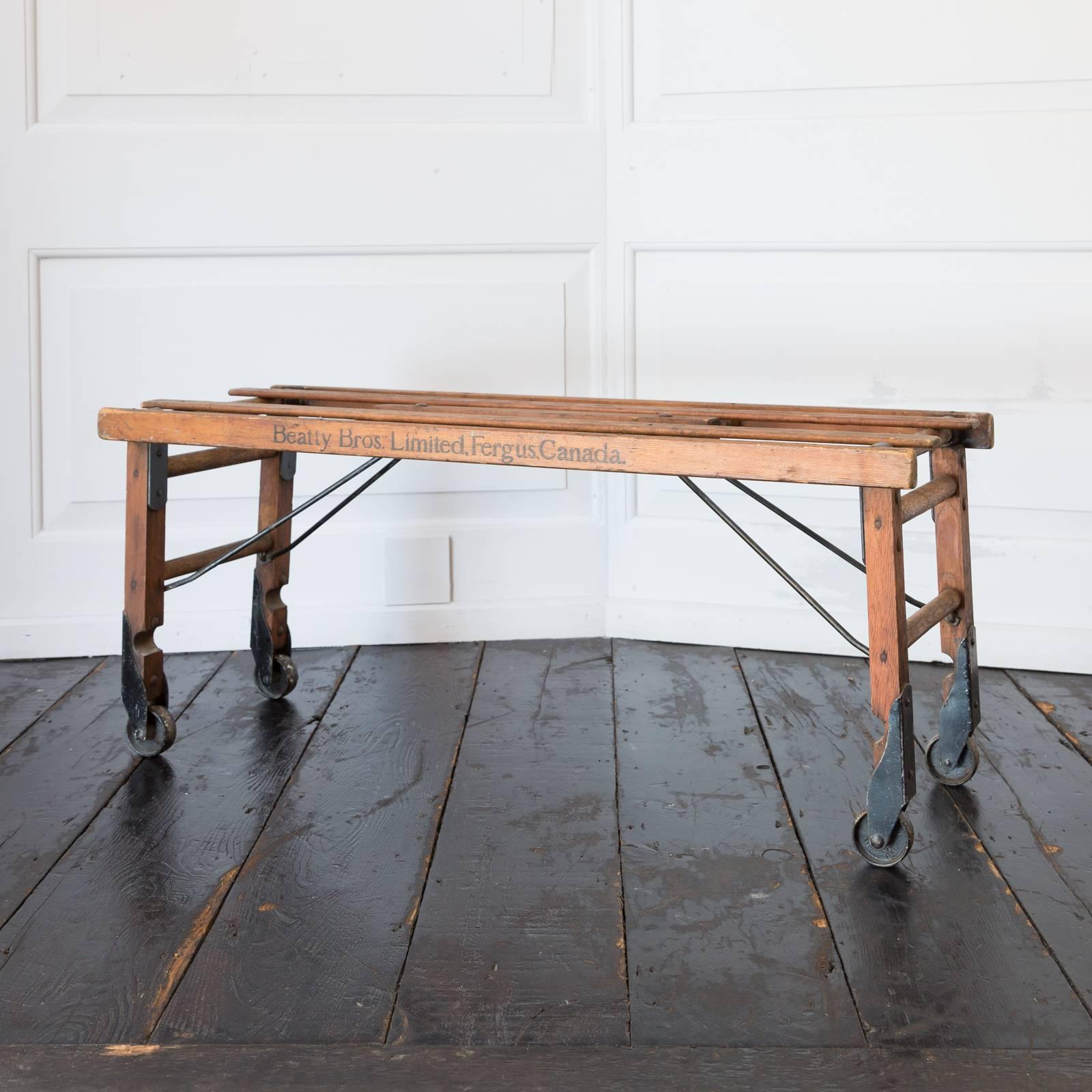 A washing bench in pine on castors, circa 1923.