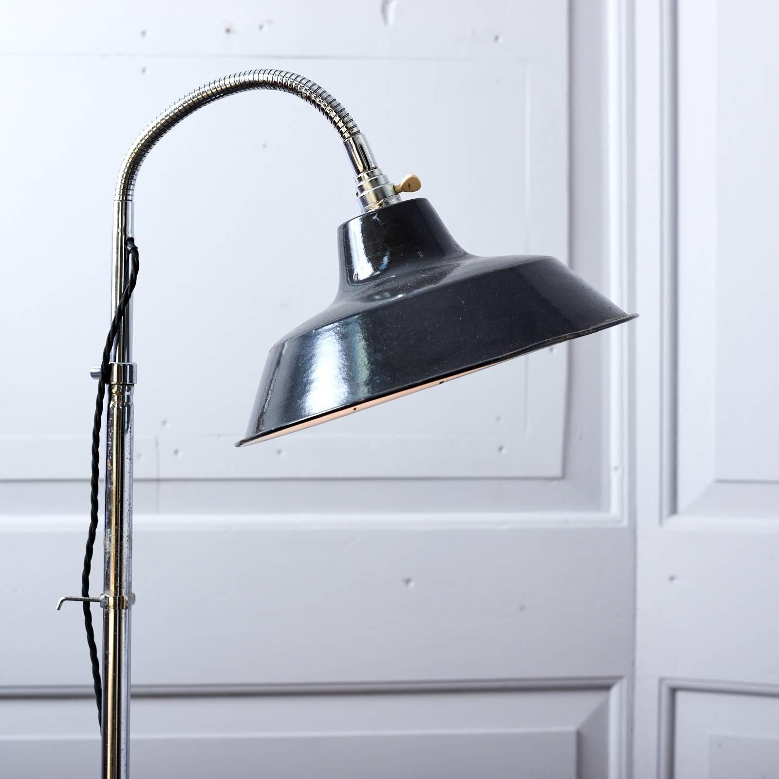 The chrome telescopic angle poise has Bakelite switch on reclaimed enamel shade with elongated goose neck and two meters flex.