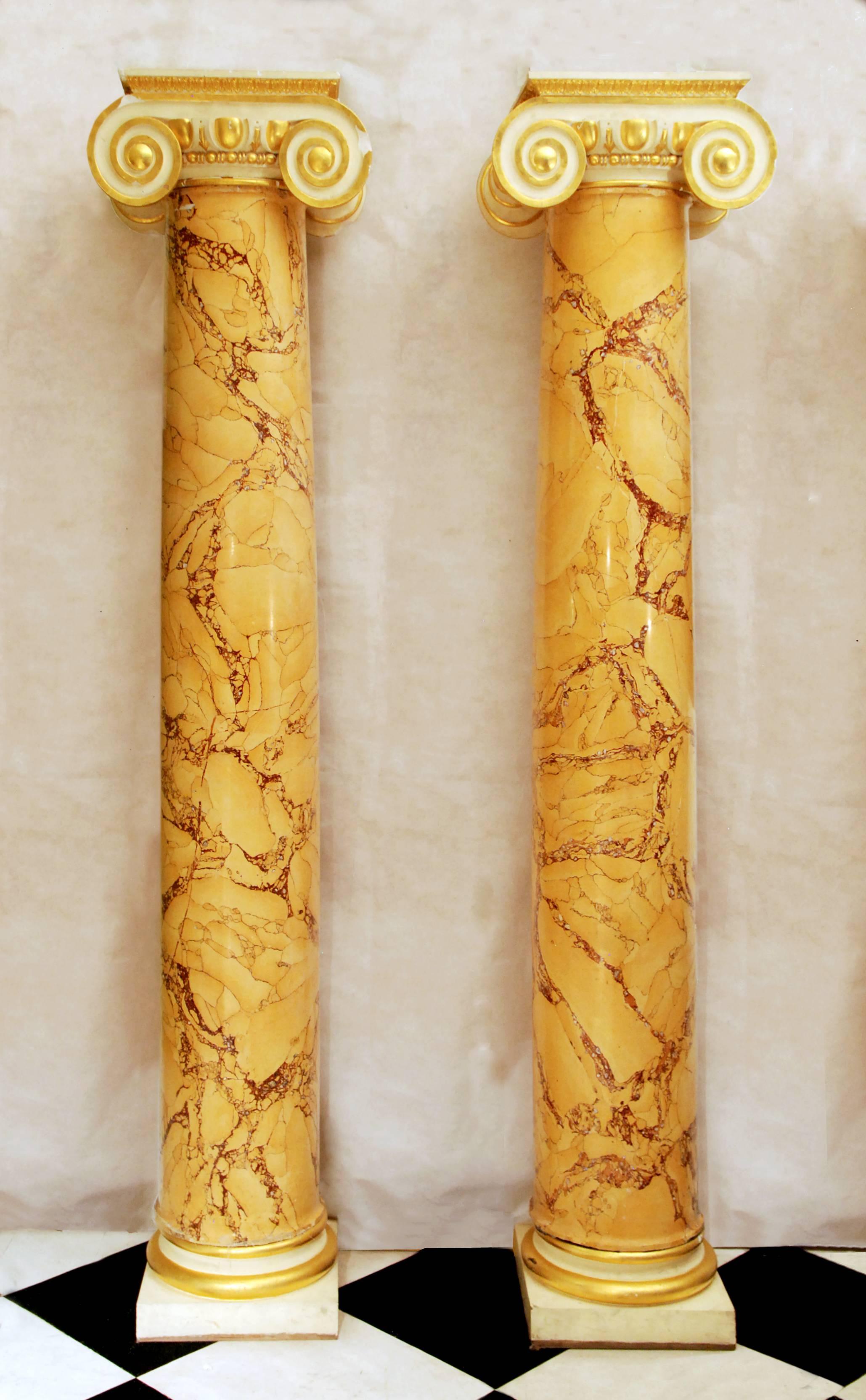 Two pairs of Sienna scagliola columns. Roman and Greek Ionic order with gilt embellishments, removed from the former residence of Prince Jefri of Brunei, previously the Playboy Club, 45 Park Lane.

Dimensions: 235cm (92½