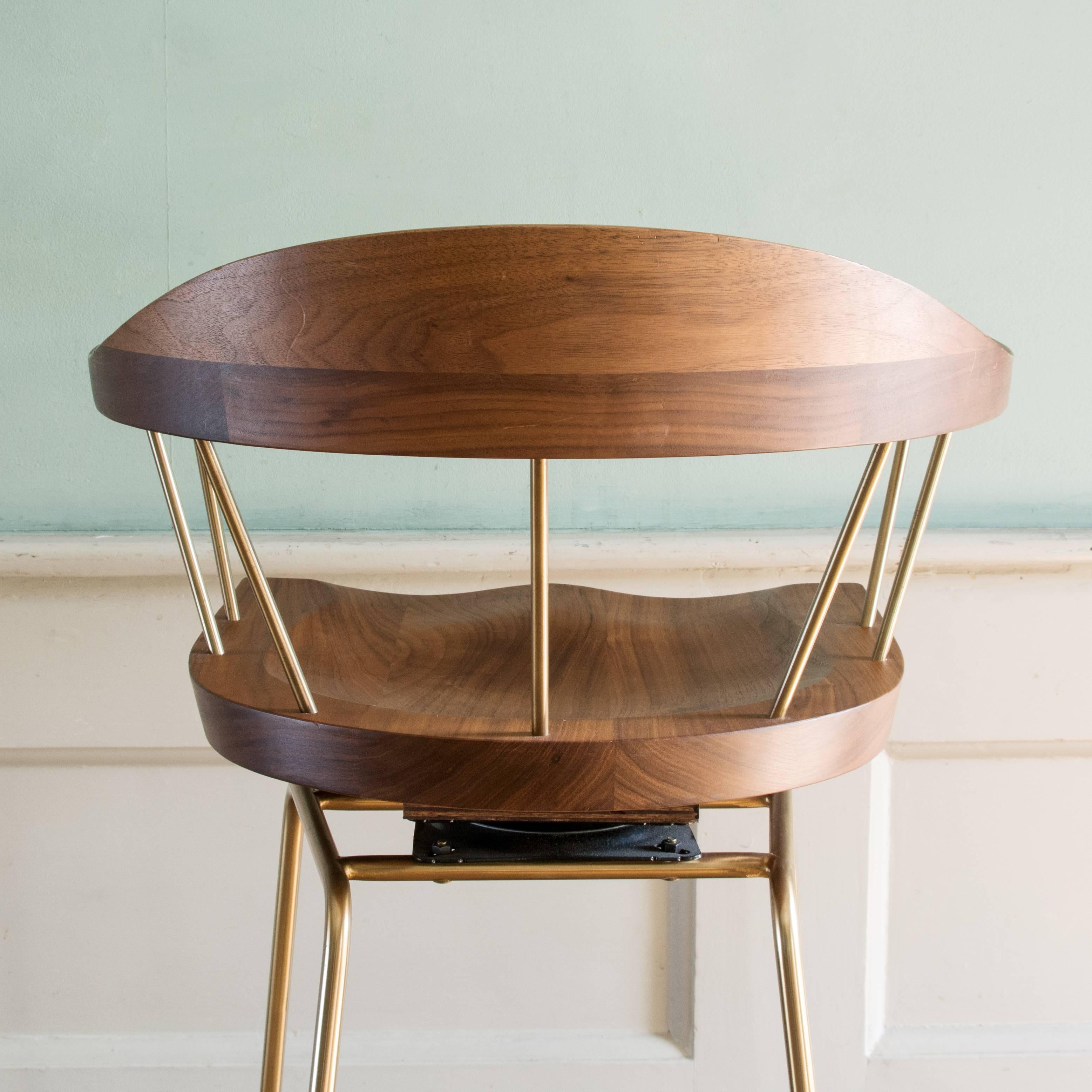 Bassam Fellow 'Spindle' bar stools, walnut and brass with rotating seat. 20 available.

Dimensions: 106cm (41¾