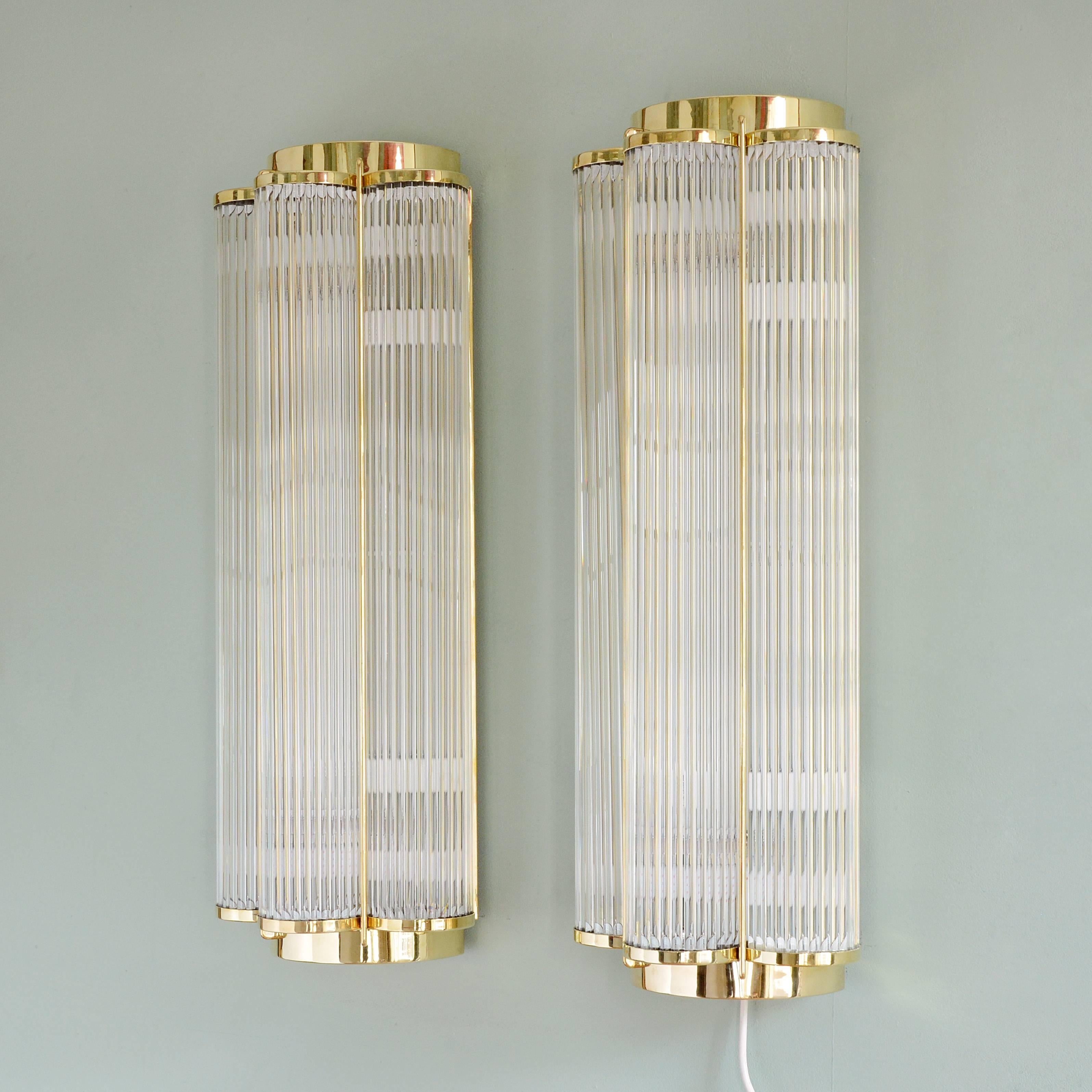 A pair of large Art Deco style wall lights, made by Lassco, with brass and glass rod trefoil body and four internal light fittings. Made to order in England in the traditional manner, lead time usually around six weeks.

Dimensions: 83cm (32¾