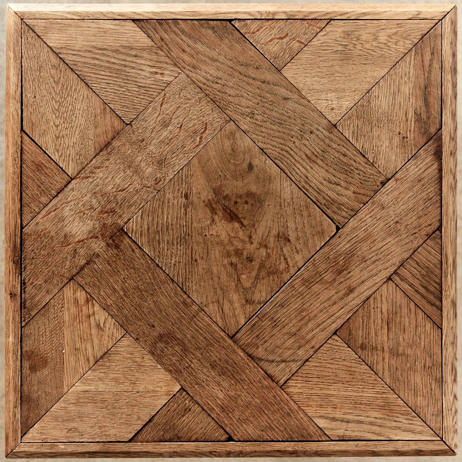Reclaimed oak Parquet de Versailles topped table, on steel base,
London made by LASSCO.