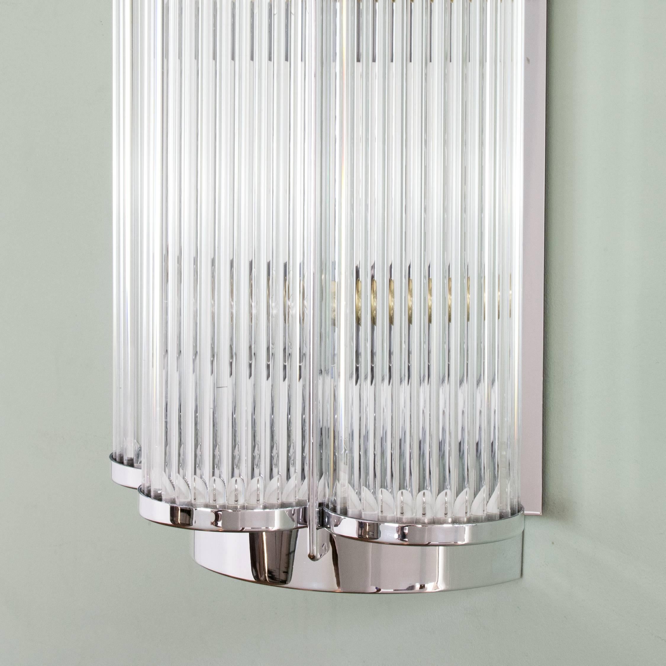 A pair of Art Deco style wall lights, made by LASSCO, with chrome and glass rod trefoil body, with four light fittings. Handmade in England to order, usual lead time six weeks.

Dimensions: 83cm (32¾