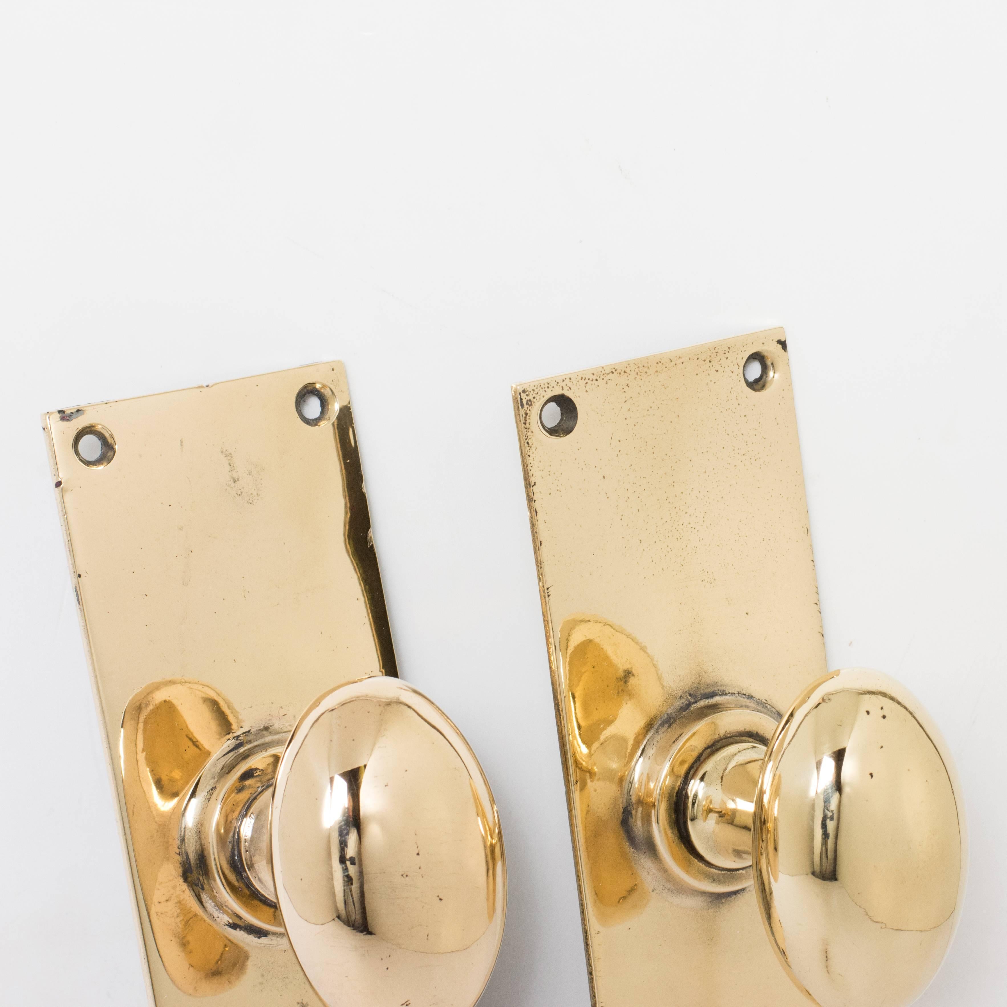 1920s oval rose brass door knobs, 3 pairs available, with rectangular backplates.

Dimensions: 15.5cm (6