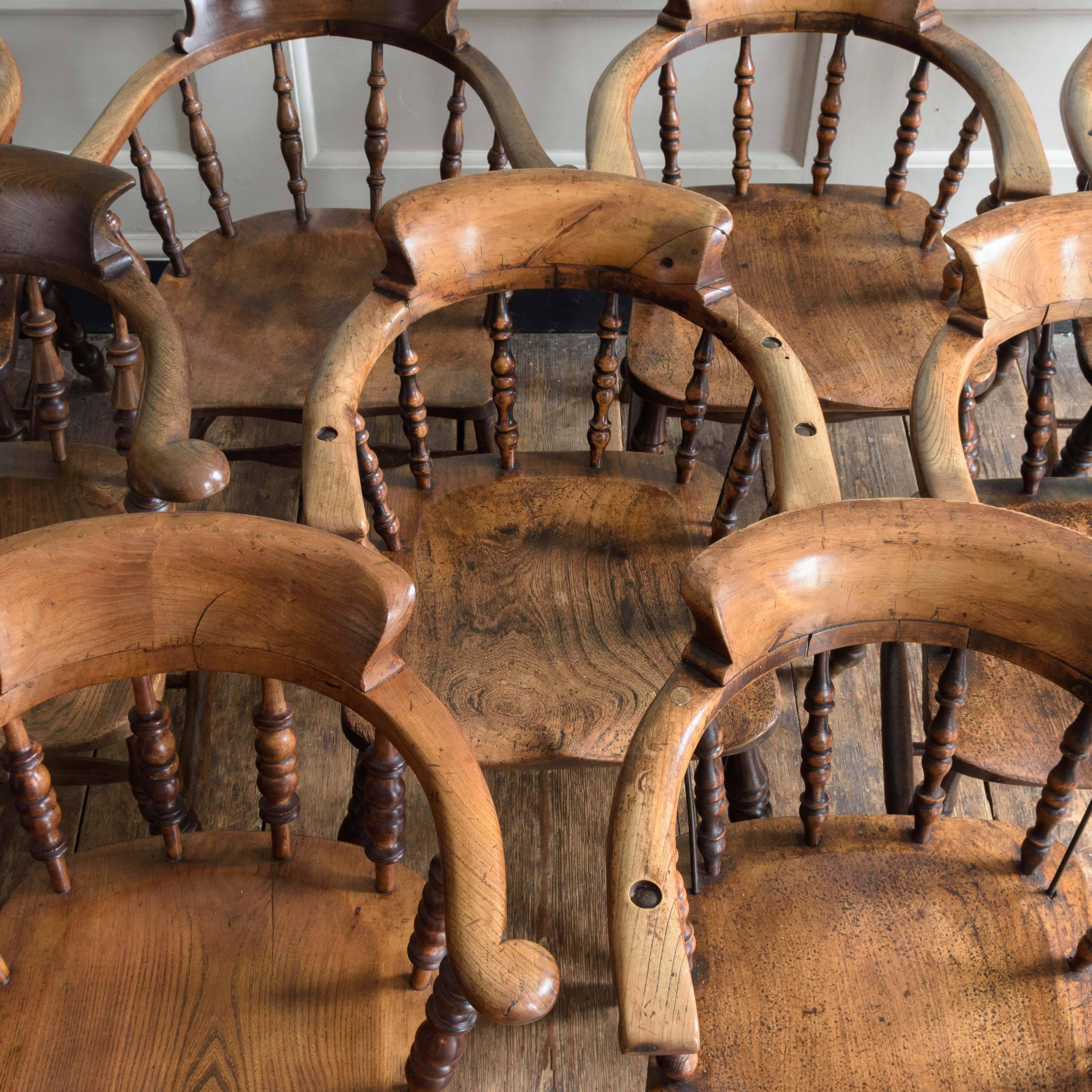 Matched set of nine stout Smoker's Bow Windsor armchairs, Yorkshire, circa 1860-1880, fruitwood, ash and elm with blacksmith's repairs.

Although commonly described as Smoker's Bow or Smoking chairs, examples such as this were commonly used as