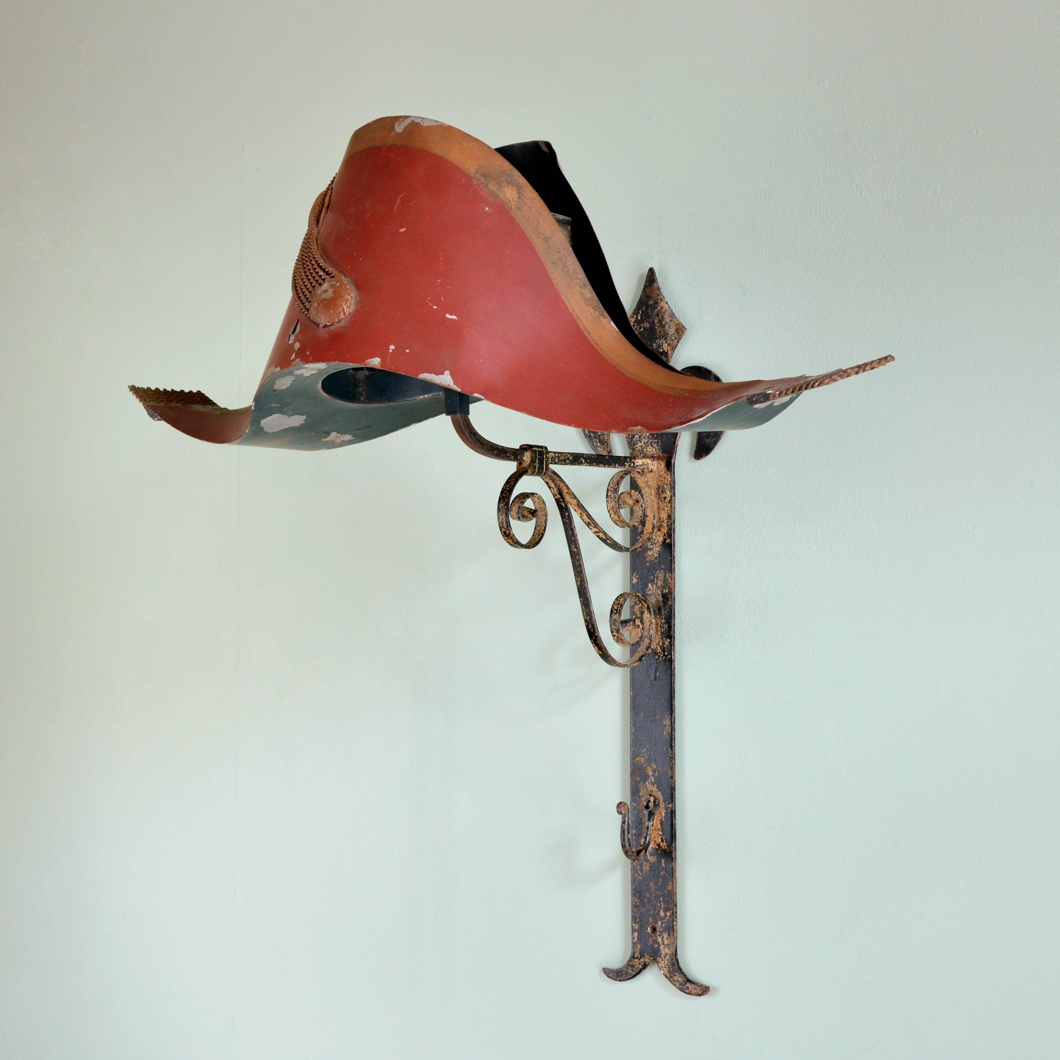 A French milliner's trade sign, first half 20th century, the eighteenth century style Bicorn hat mounted on wrought iron wall bracket.

Available to view at Brunswick House, London.

Dimensions: 61cm (24