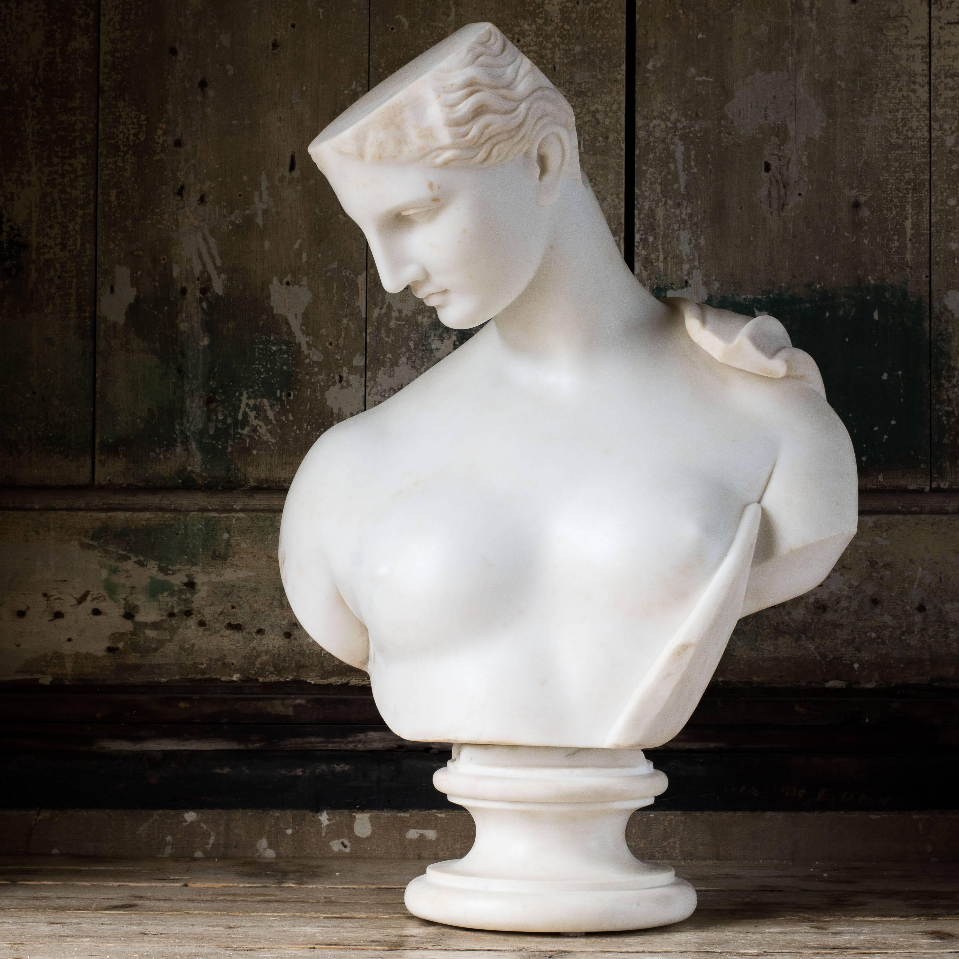 A statuary marble bust depicting Psyche of Capua, circa 1860, after the Greek original, on turned socle. Signed 'Gino Rossi' (Giuseppe Rossi, 1823-1907, Italian).