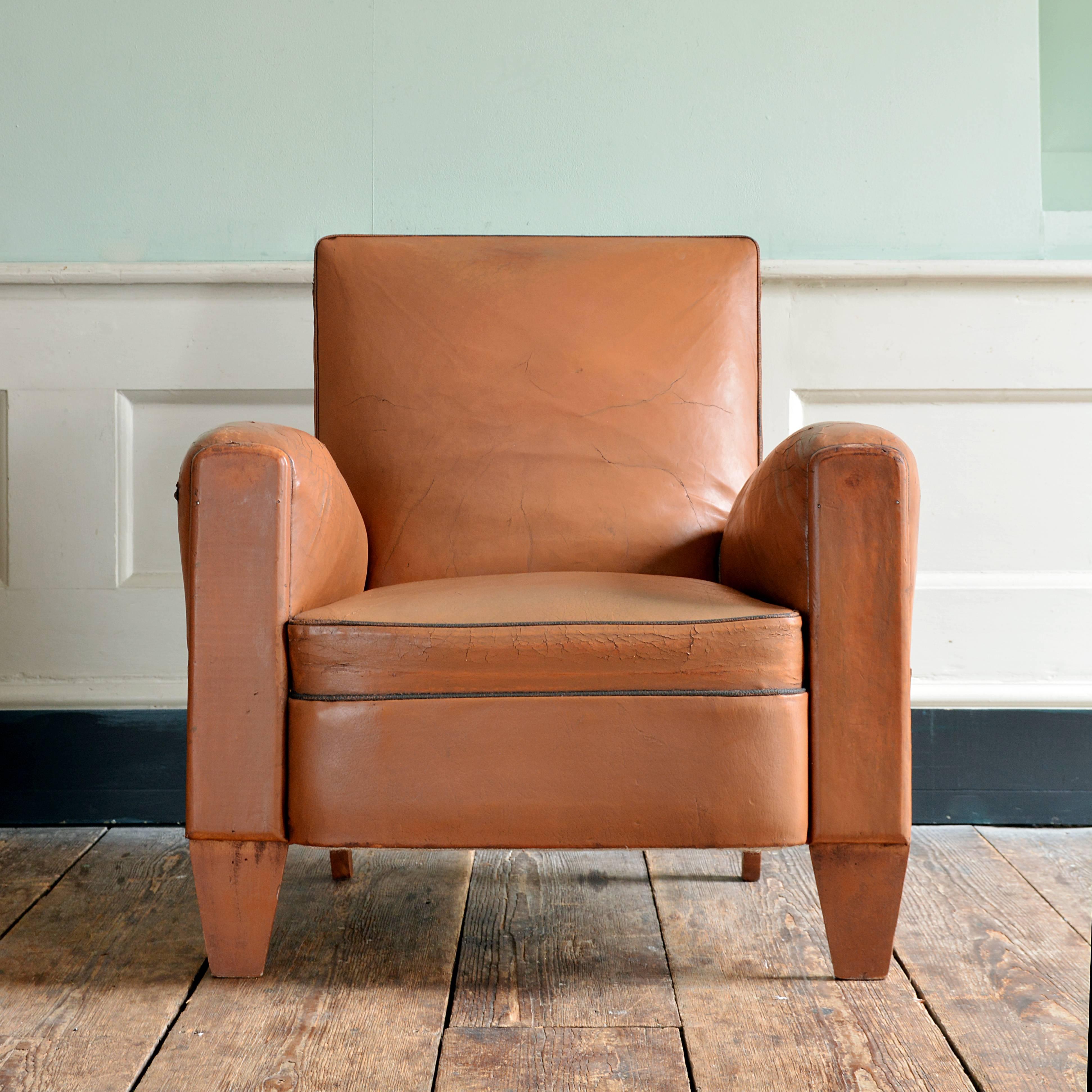 A near pair (front feat slightly different) of French leather upholstered club chairs, circa 1945.

Available to view at Brunswick House, London.

Dimensions: 82cm (32¼