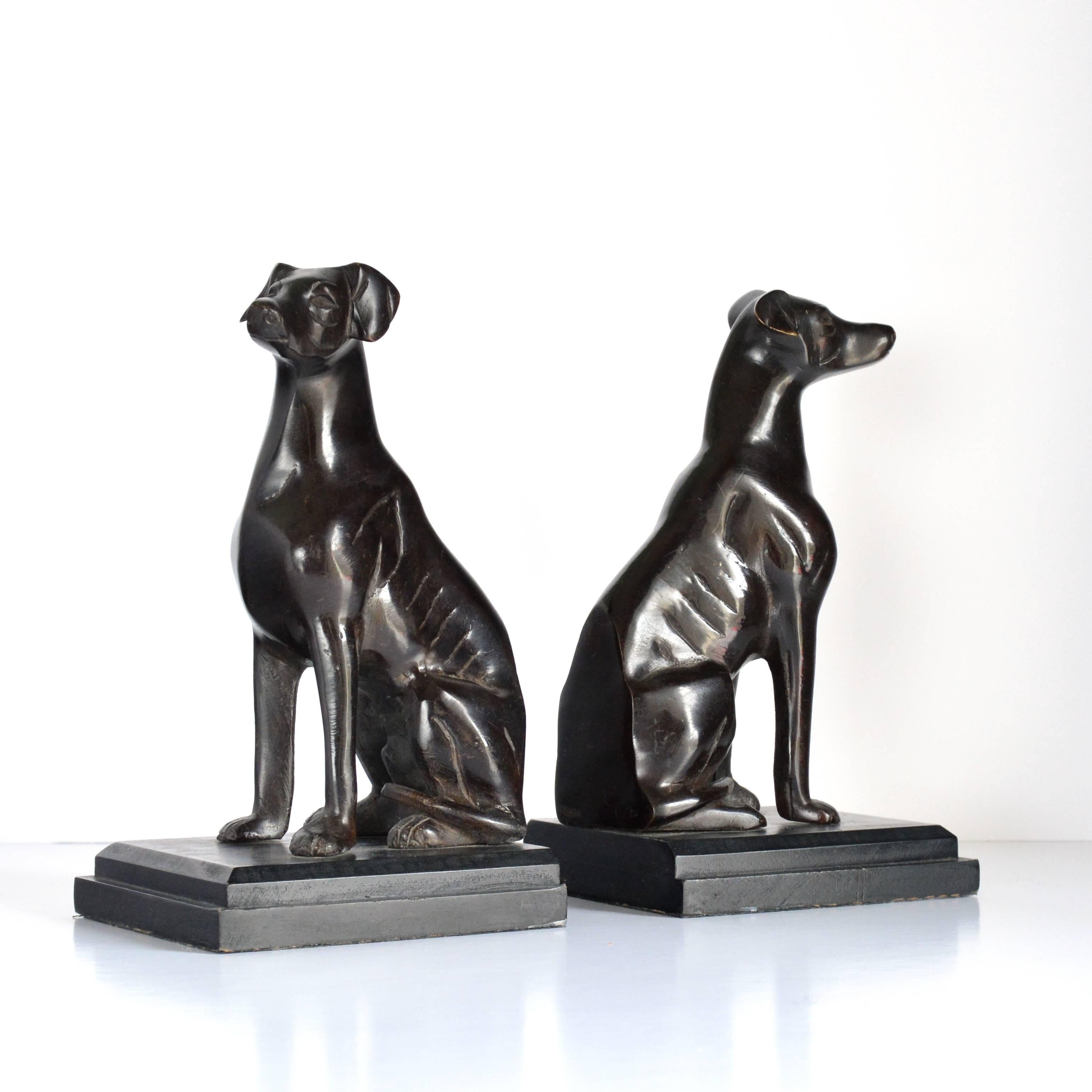 A pair of bronze bookends, modelled as dogs sitting on their haunches, 20th century.

Available to view at Brunswick House, London.

Each: 21cm high, 12cm wide, 11cm deep.