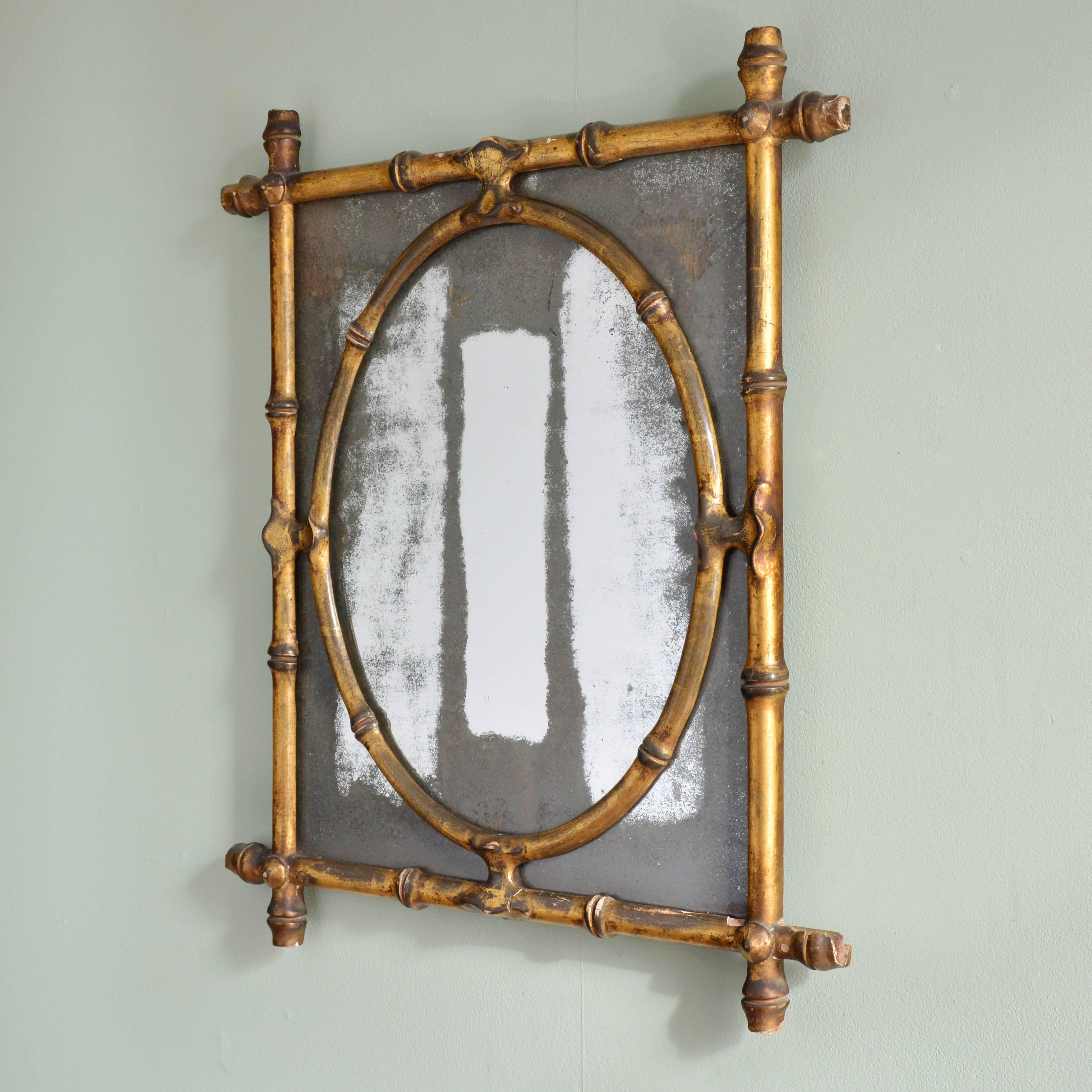 An early 19th century faux bamboo wall mirror, gilt, original plate glass.

Available to view at Brunswick House, London.

Dimensions: 58cm (22¾