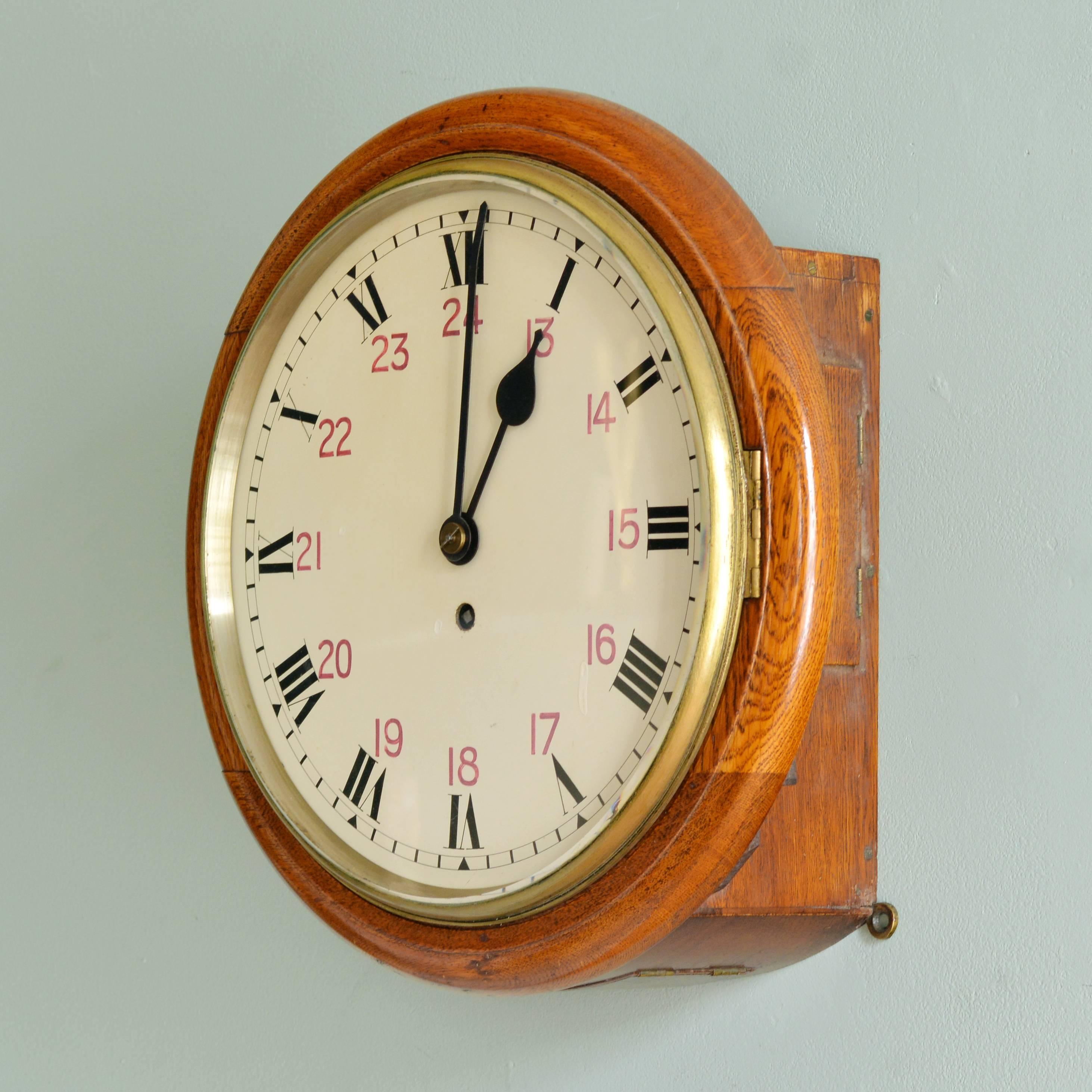 An oak cased dial clock, the 12