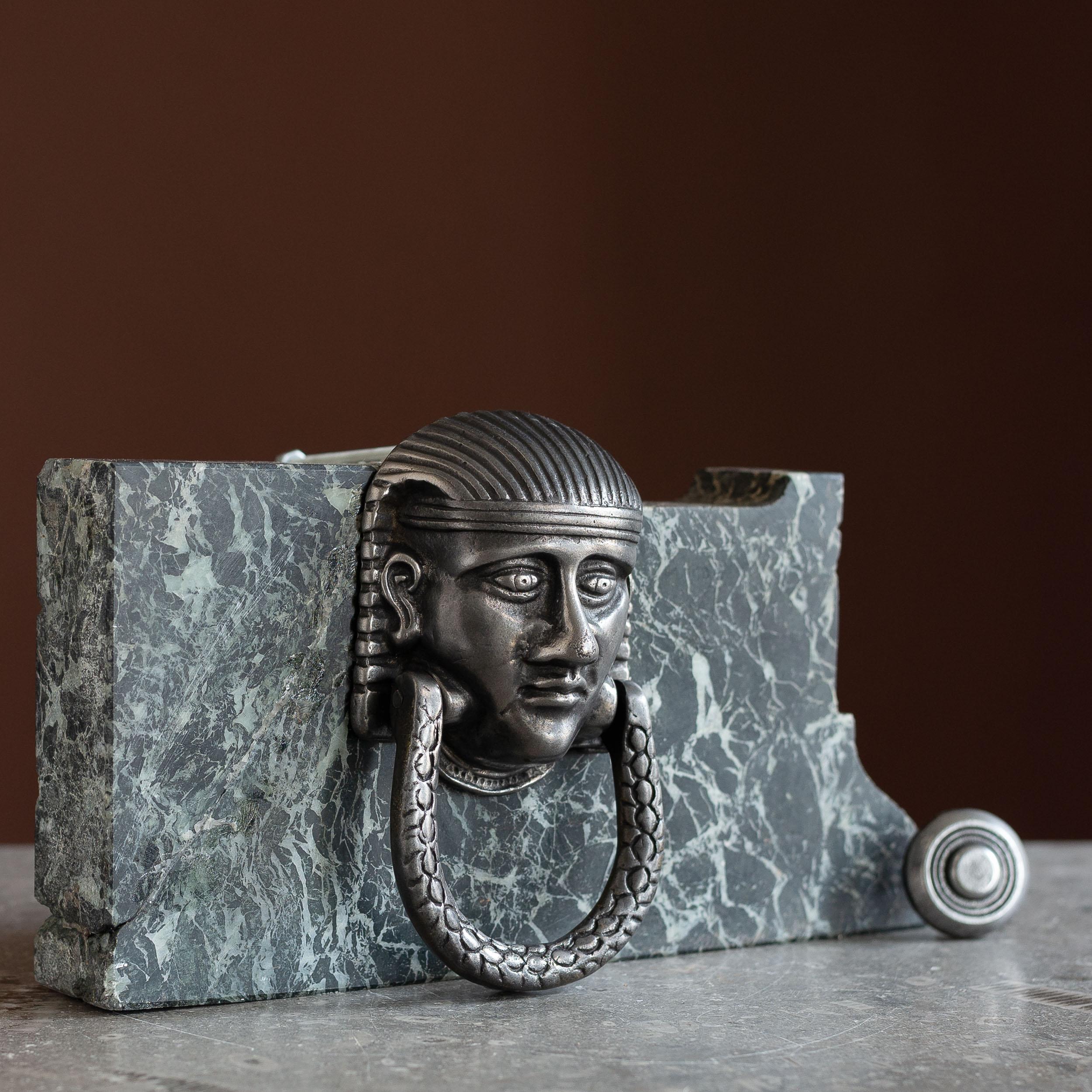 A well cast nineteenth century Sphinx door knocker, cast iron, with new strike plate.

In good antique condition and ready for regular use. Will require painting or sealing to resist rust.