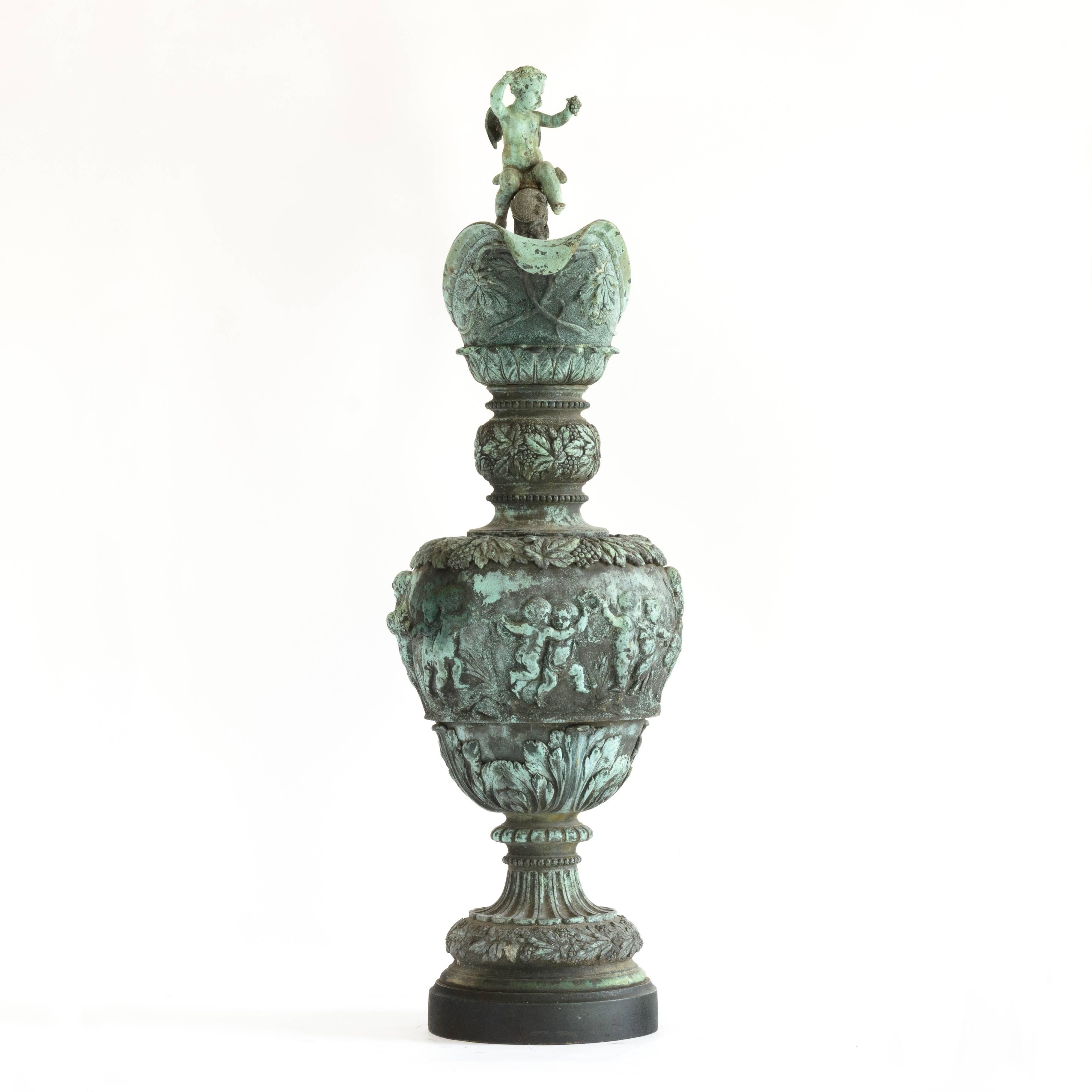 French mid-19th century bronze ewer, exhibited at The Great Exhibition of 1851, the design attributed to Villemsens of Paris, in the Renaissance style, the bulbous body cast with bacchanalian scenes of frolicking putti, the elaborate handle