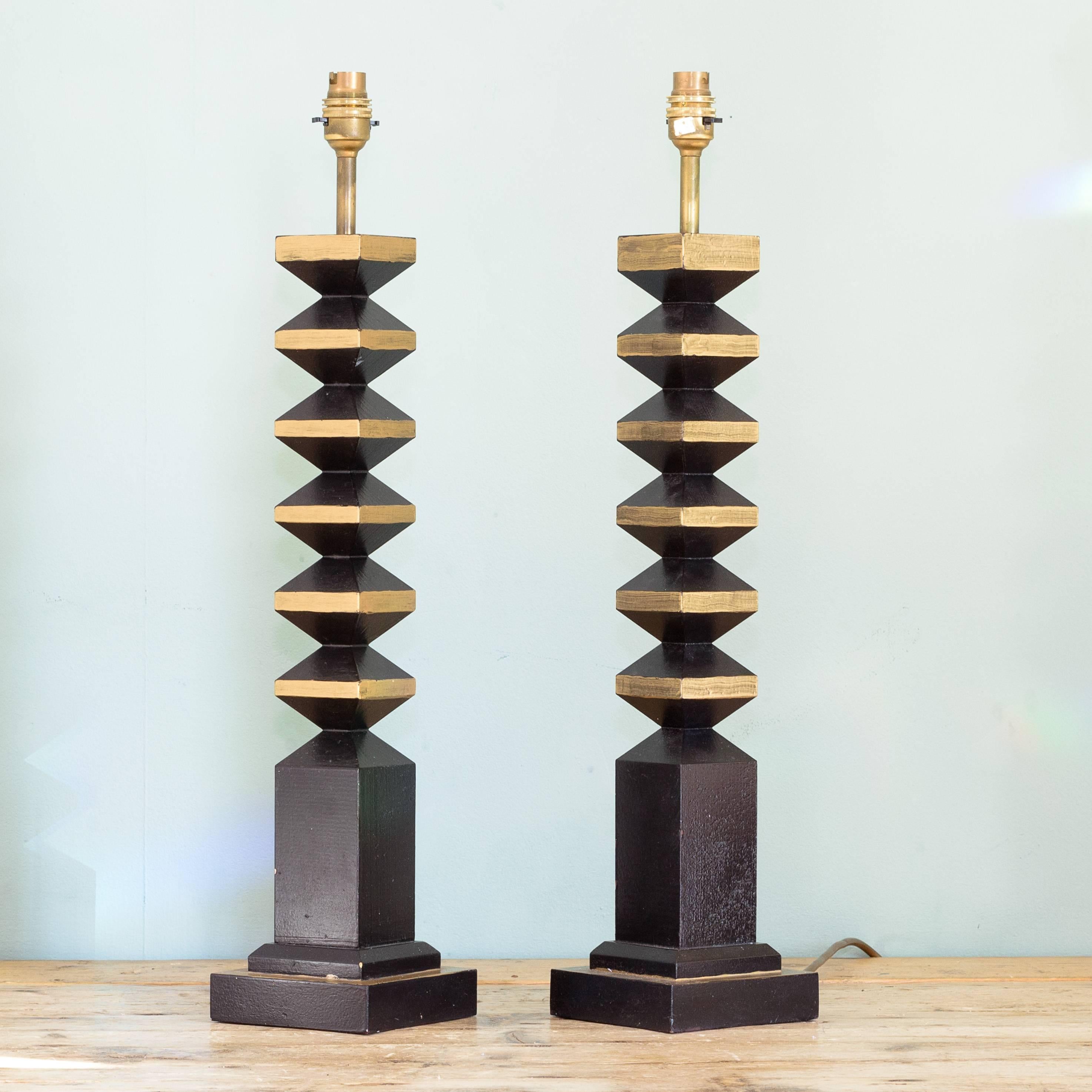 Pair of French, 1980s 'TOTEM' table lamps, black painted timber with gold highlights, handmade.